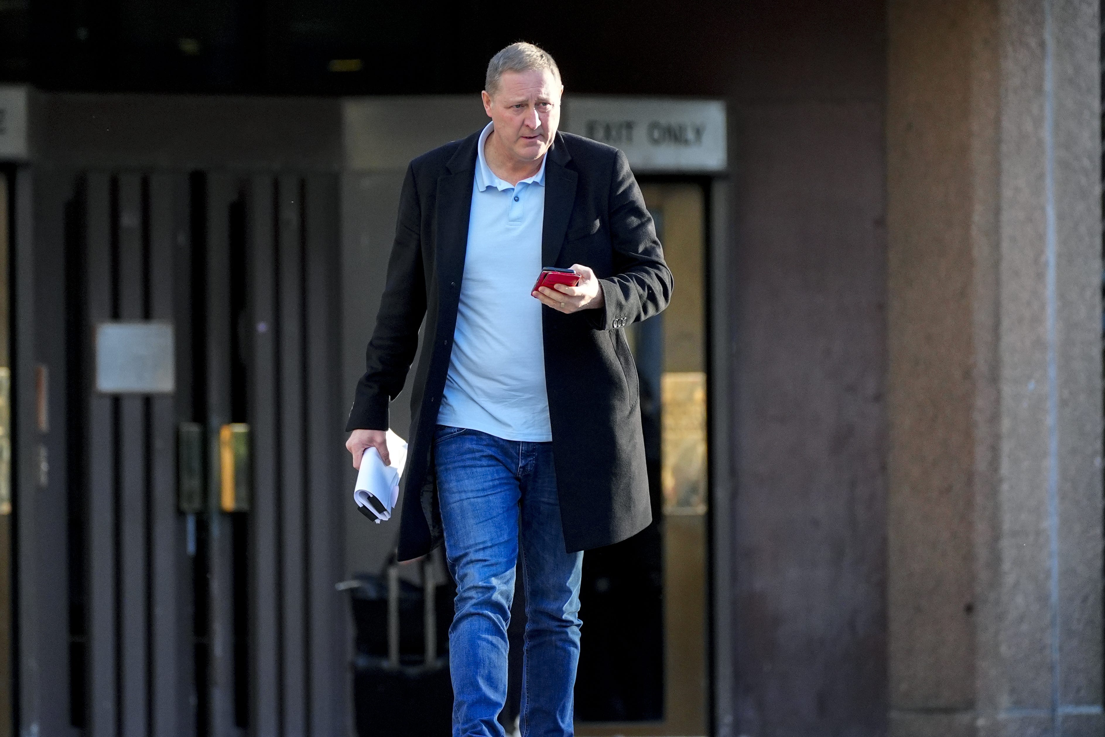 Paul Owen outside Liverpool Crown Court, where he is charged alongside three others with assisting an offender (Peter Byrne/PA)