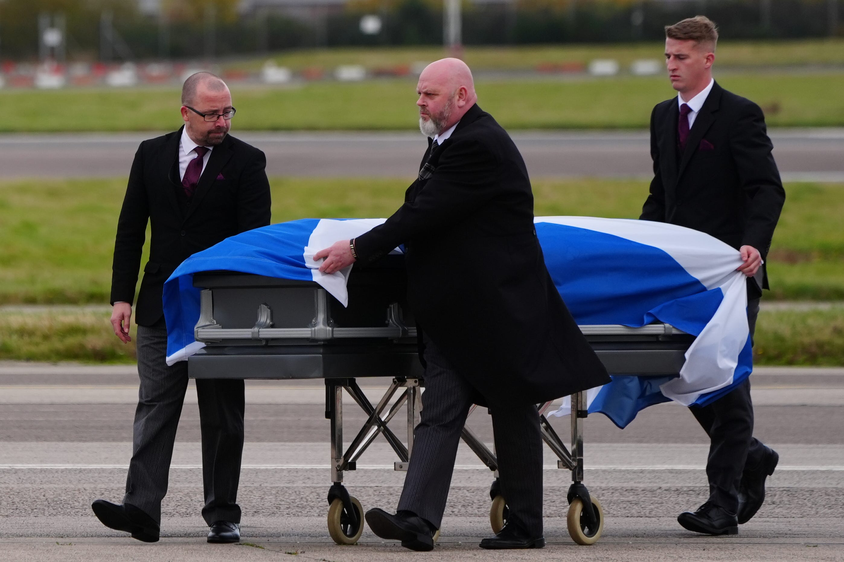 A Saltire covering the coffin of Alex Salmond during its repatriation back to Scotland was placed there by Alba Party Chairwoman Tasmina Ahmed-Sheikh before it was carried onto a private plane in Orhid, North Macedonia (Jane Barlow/PA)