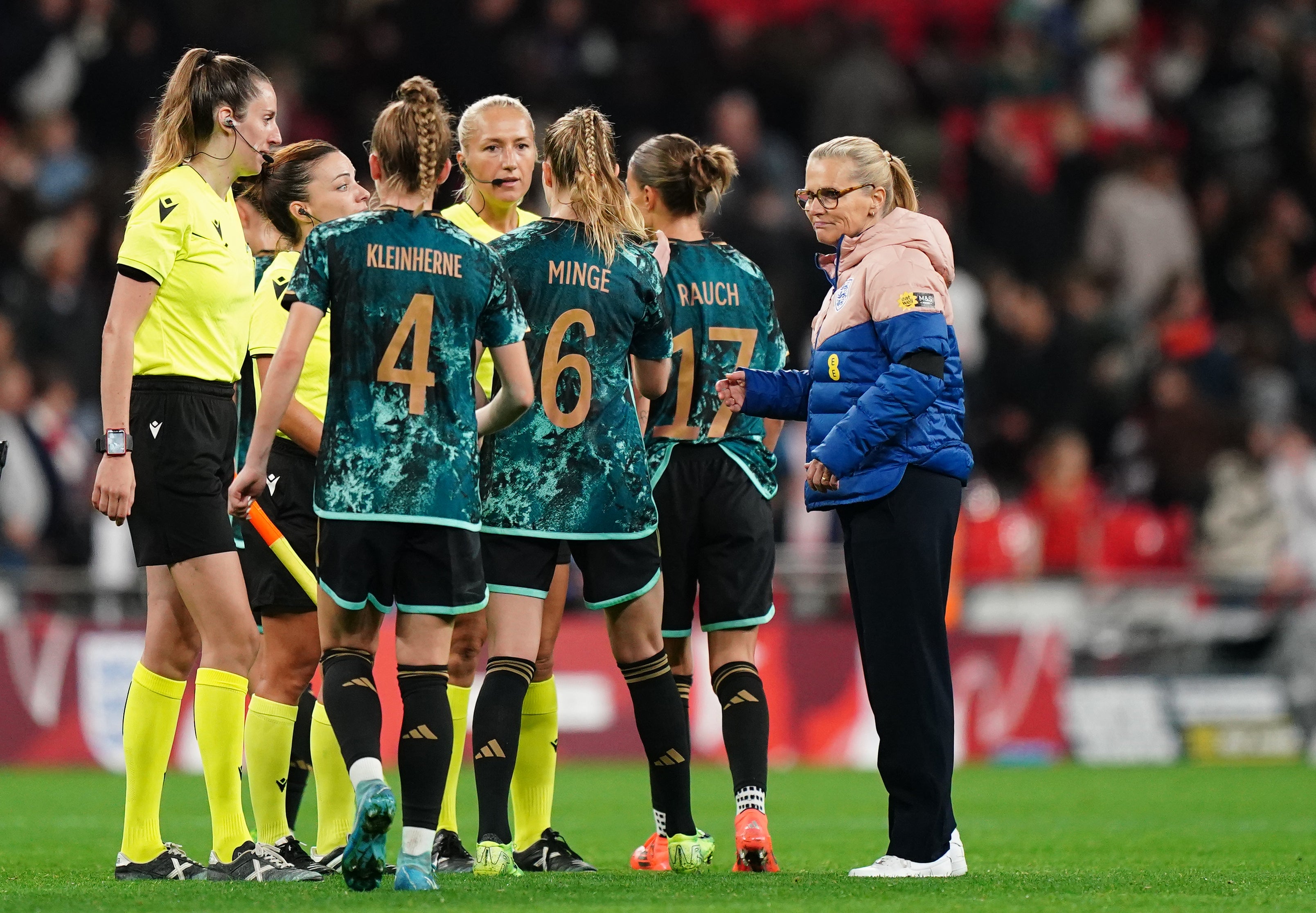 Sarina Wiegman, right, congratulates the Germany players after their win at Wembley (Zac Goodwin/PA)