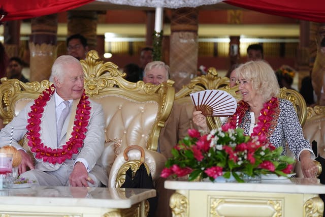 <p>King Charles III and Queen Camilla talking during a farewell ceremony at Siumu Village on the final day of the royal visit to Australia and Samoa</p>