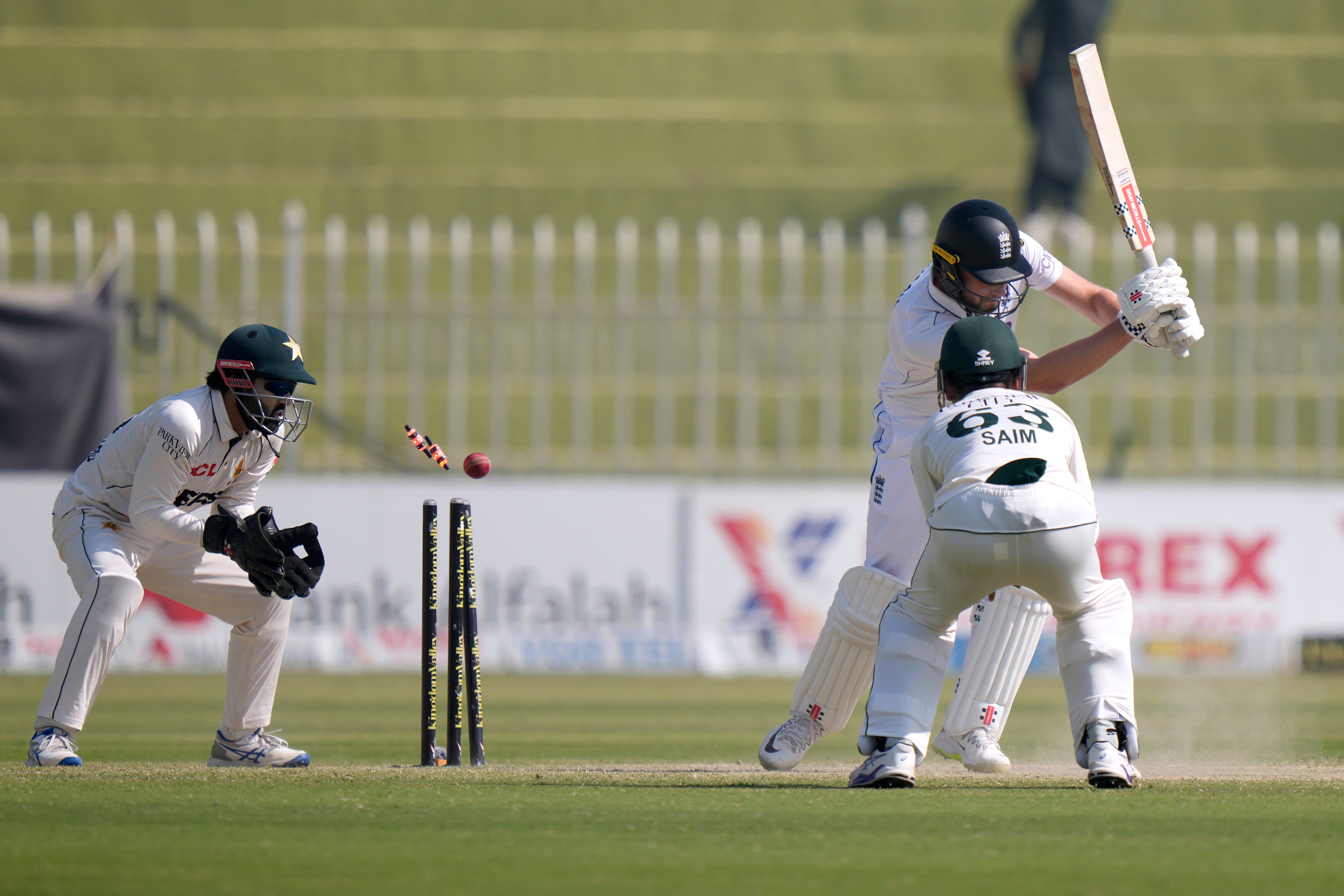 England’s Gus Atkinson, second right, is bowled by Pakistan’s Sajid Khan during the day three of third test cricket match between Pakistan and England, in Rawalpindi, Pakistan, Saturday, Oct. 26, 2024. (AP Photo/Anjum Naveed)