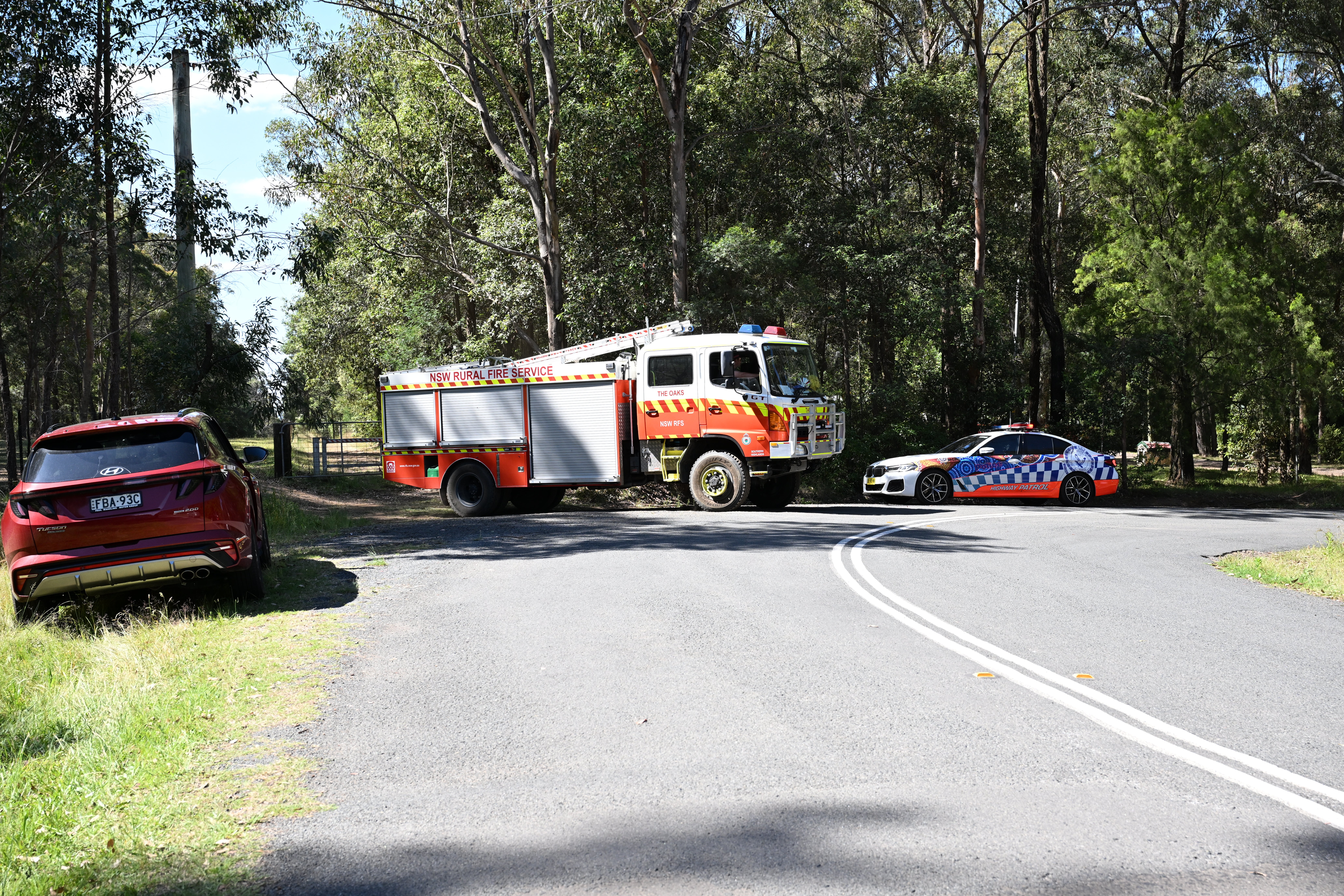 Police and firefighters at the scene where two planes collided and crashed in the vicinity of Belimbla Park near Oakdale, Sydney, Australia, on 26 October 2024