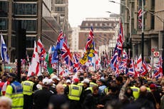 Thousands gather for Tommy Robinson’s protest as activist remains in custody