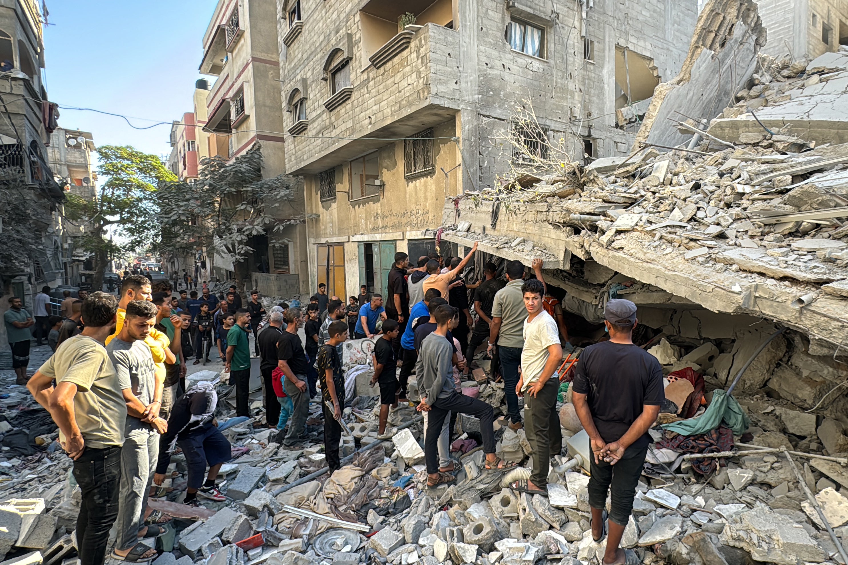 Palestinians inspect the damage after an Israeli airstrike the previous night in Beit Lahia, in the northern Gaza Strip on October 20, 2024, amid the ongoing conflict between Israel and the Palestinian Hamas militant group.