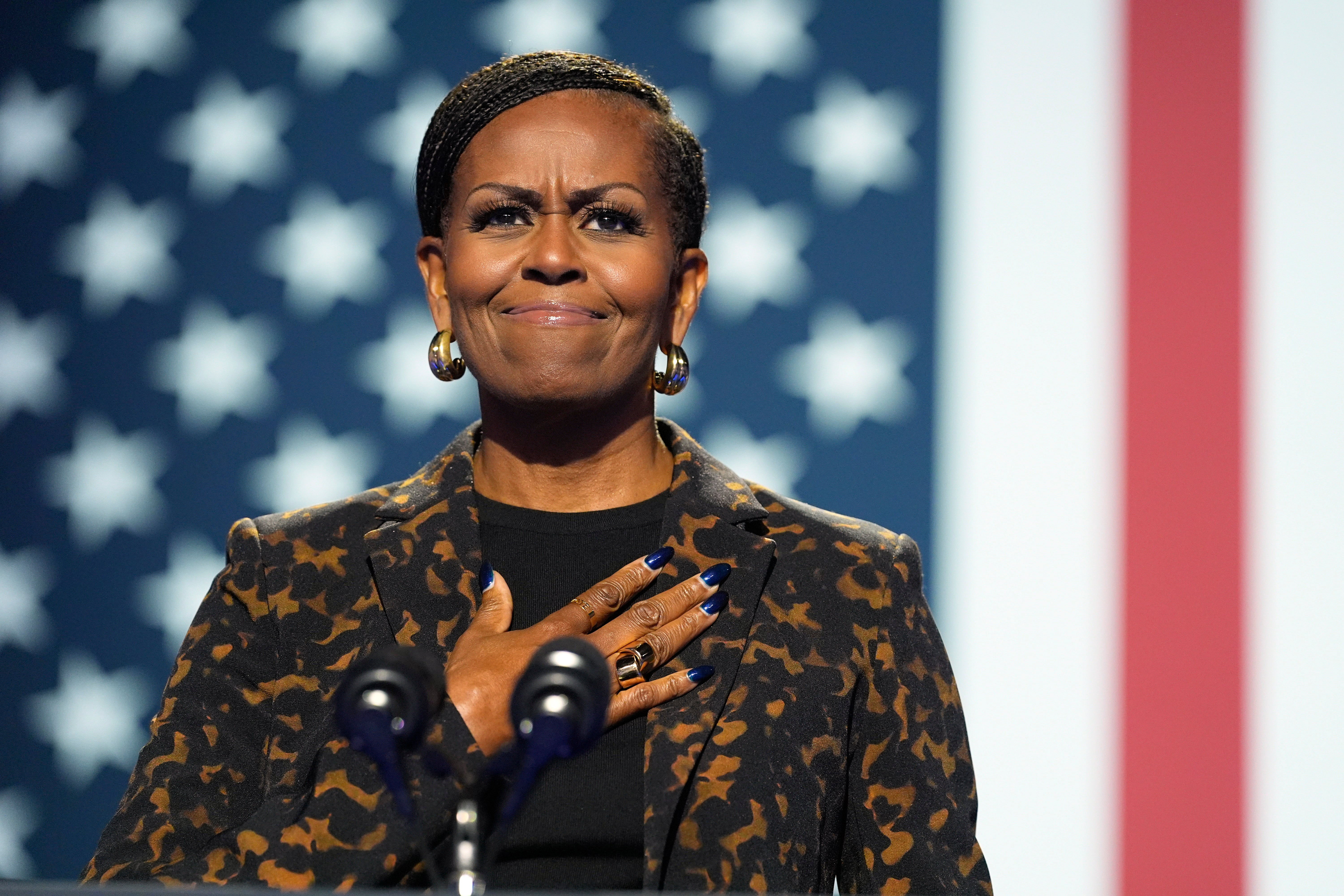 Michelle Obama laid into Donald Trump as a ‘felon, slumlord and a predator’ during her remarks in Michigan on October 26.