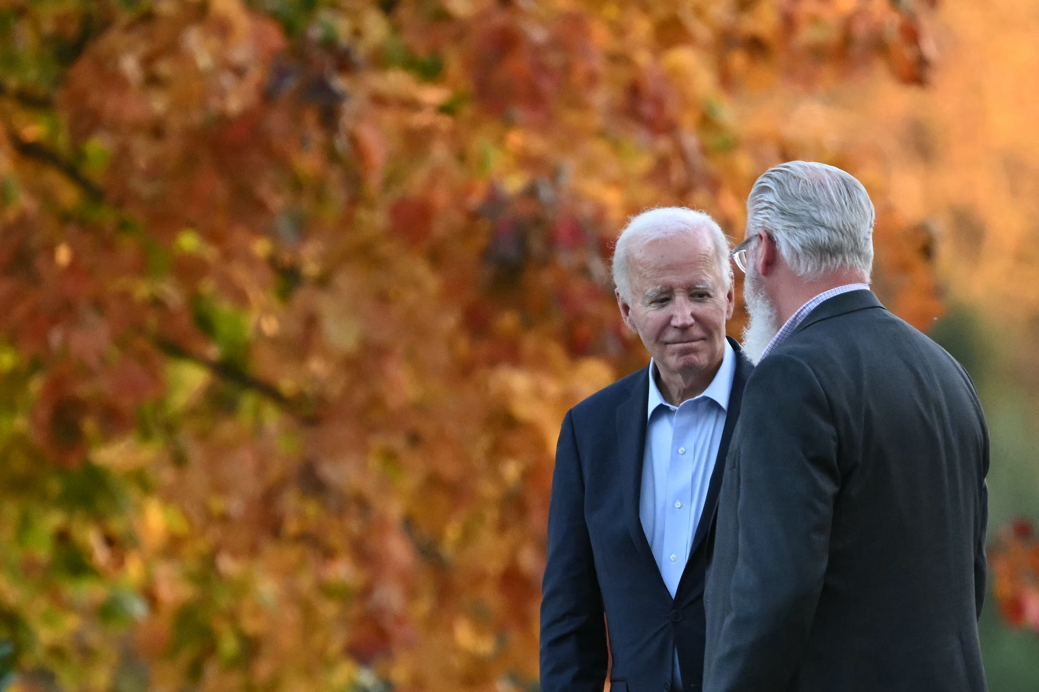 US president Joe Biden talks to a parishioner in Delaware on 26 October 2024