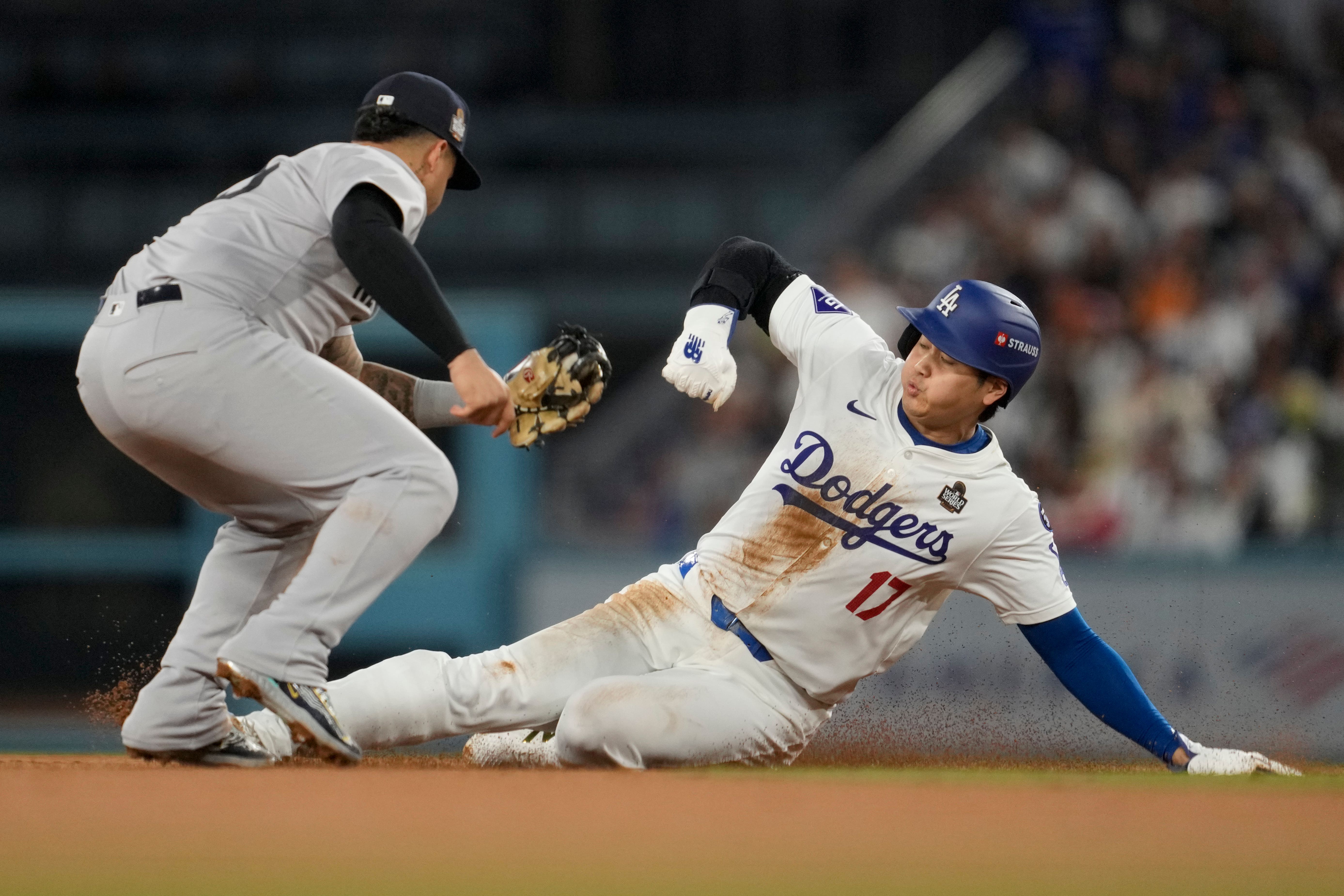 Los Angeles Dodgers’ Shohei Ohtani is injured as he is tagged out by New York Yankees second baseman Gleyber Torres (Ashley Landis/AP)