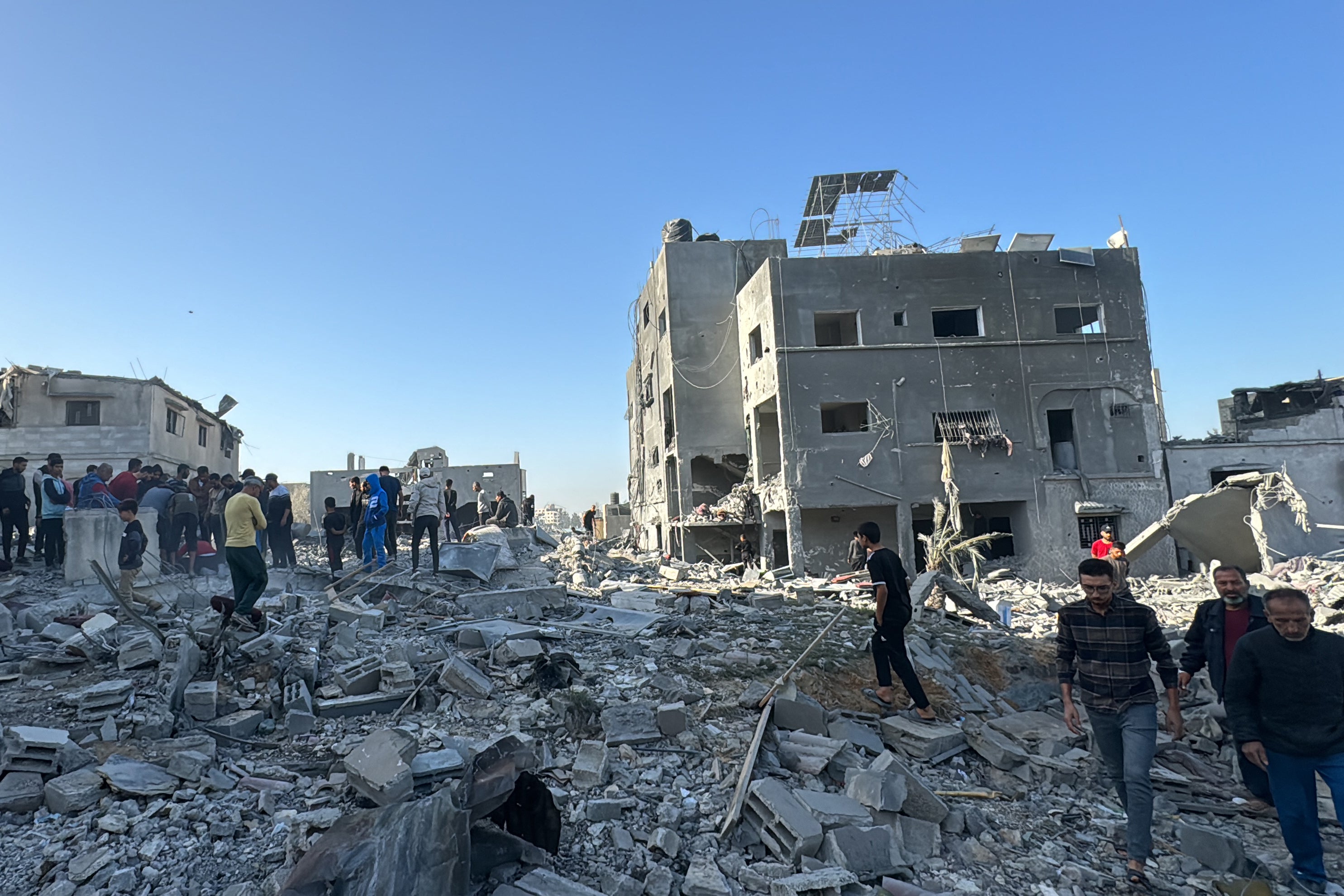 Palestinians inspect the damage after an overnight Israeli airstrike in Beit Lahia the northern Gaza Strip on October 27