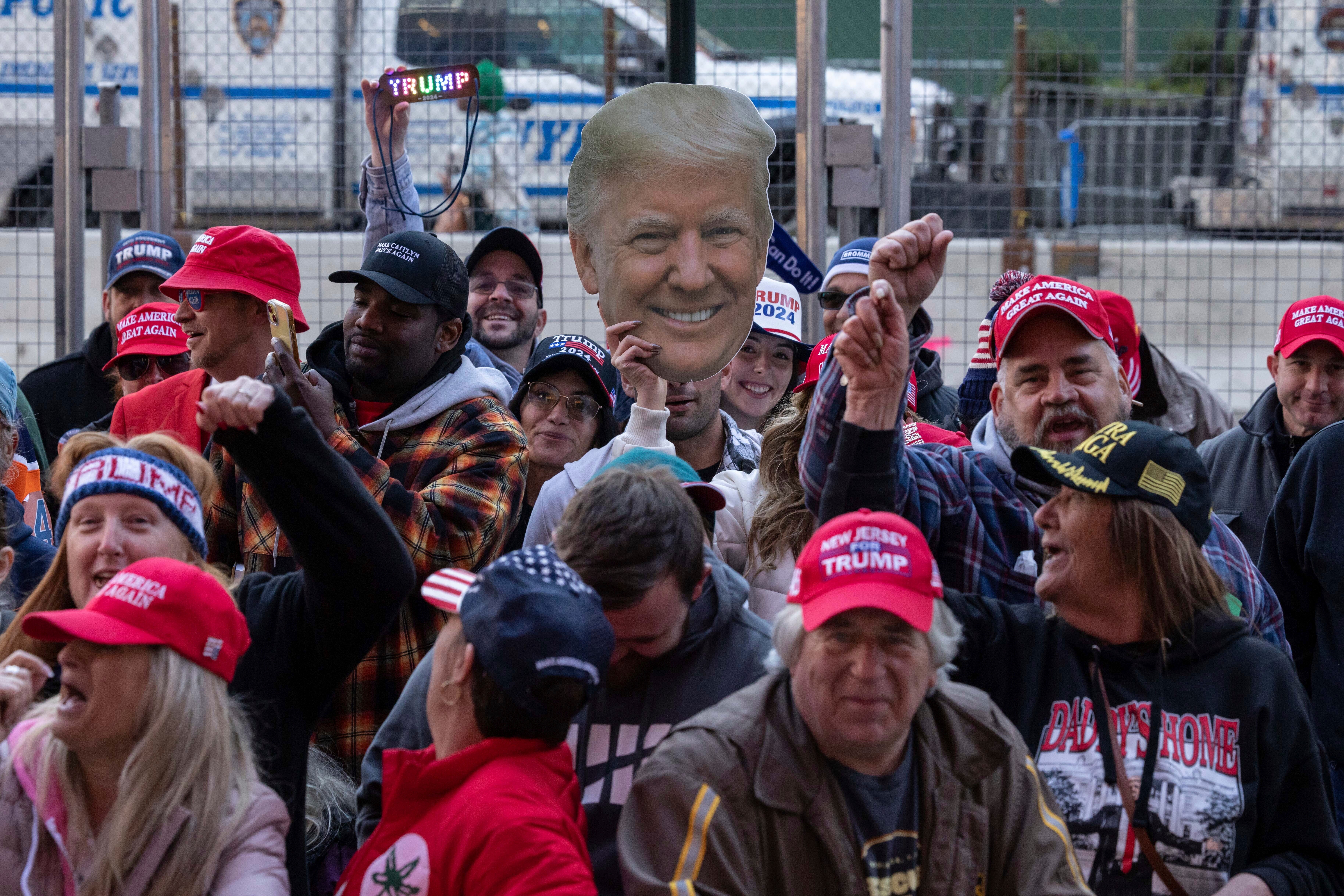 Supporters of Donald Trump - and a few protestors - swarmed the streets of New York City Sunday ahead of his rally