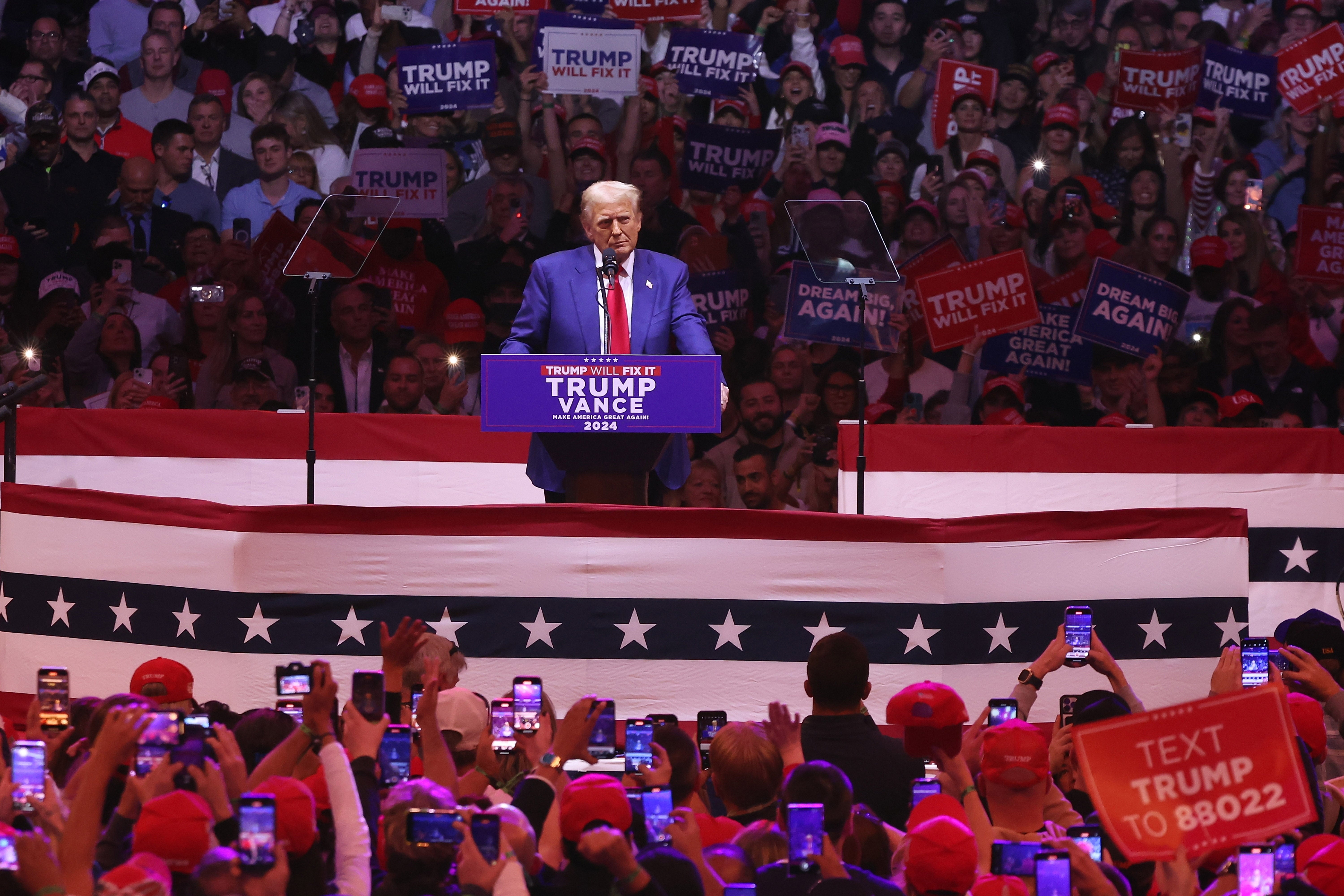 Donald Trump speaks at a rally in New York City on Sunday. The Madison Square Garden crowd was loud in its support for the Republican nominee and his other campaign friends during a massive rally in the deep blue city