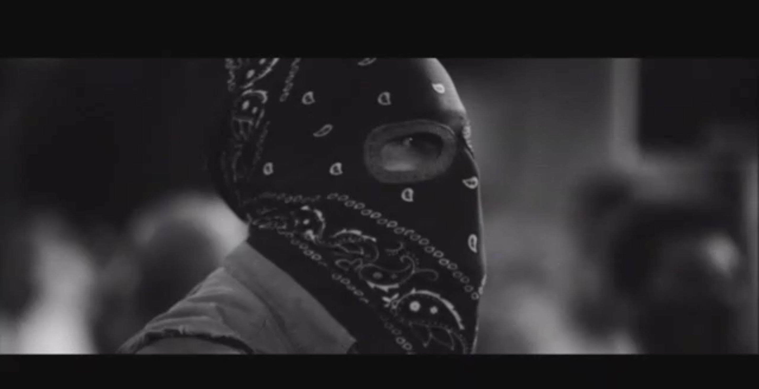 Image of bandana-covered protester used in Trump’s latest ad