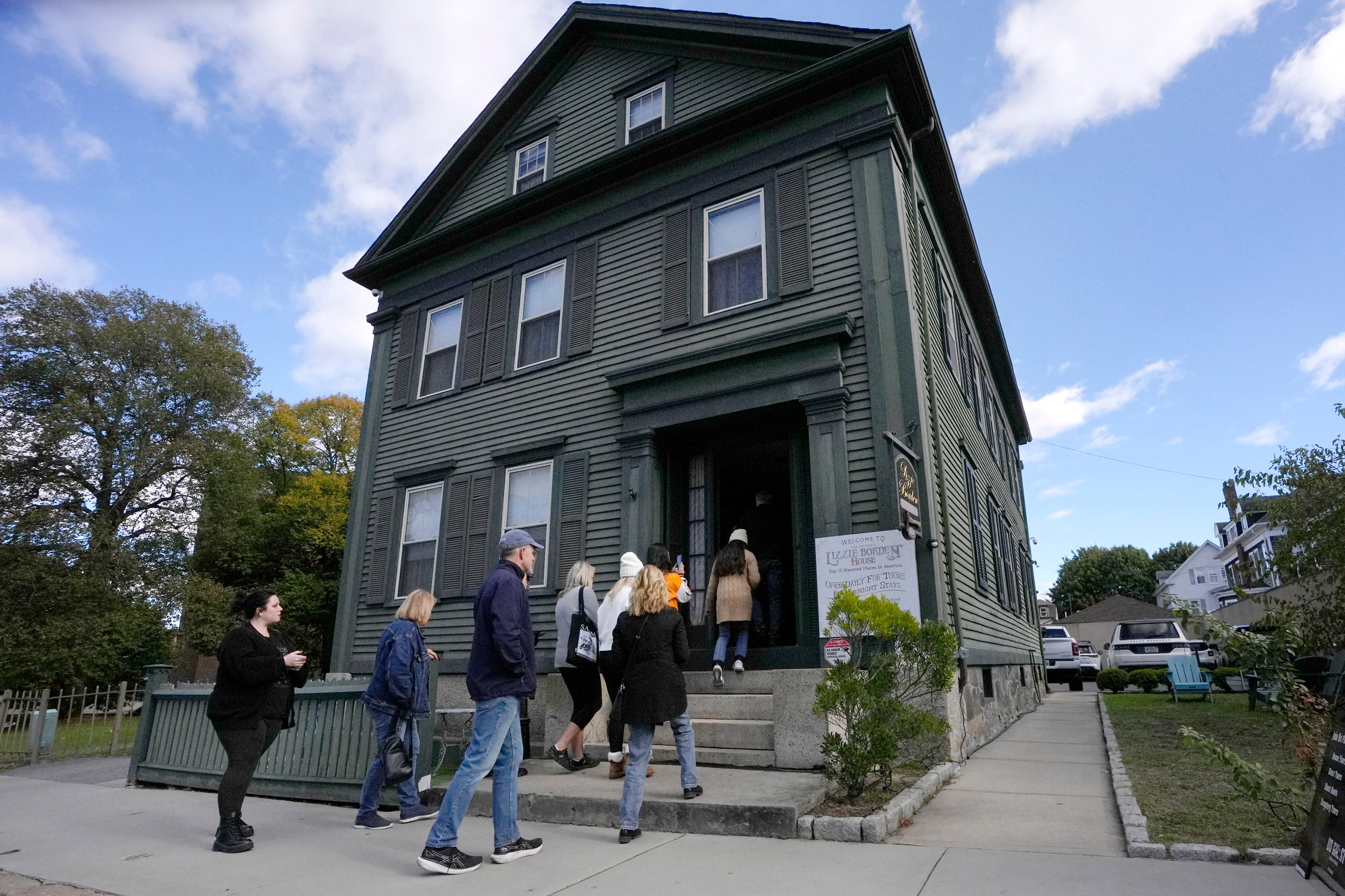 Visitors enter the Lizzie Borden House, site of an 1892 double axe murder, Wednesday, Oct. 16, 2024, in Fall River