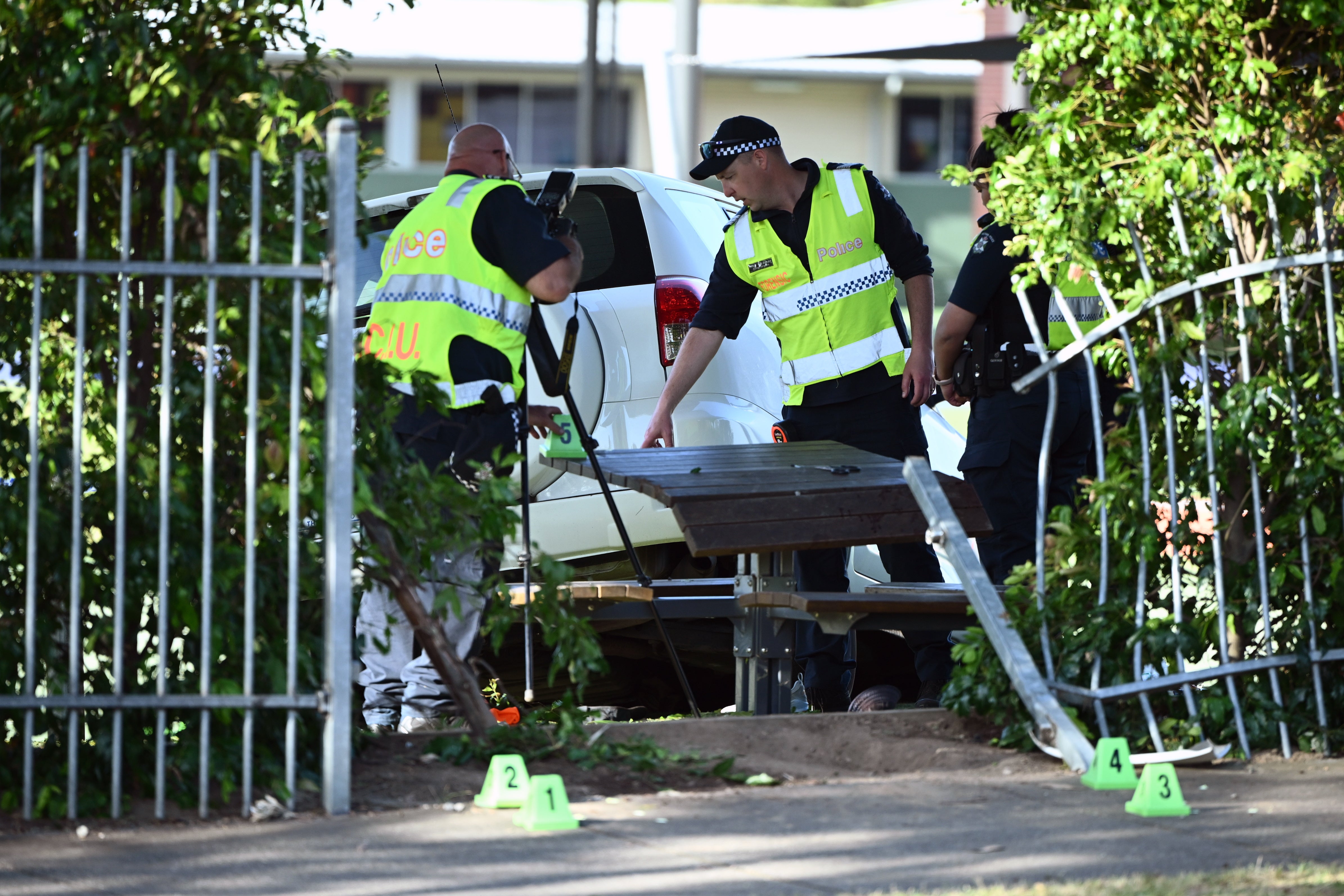 Victoria police inspect the scene where a car crashed through a fence at Auburn South Primary School, Tooronga Road, Hawthorn East, in Melbourne, Australia, 29 October 2024