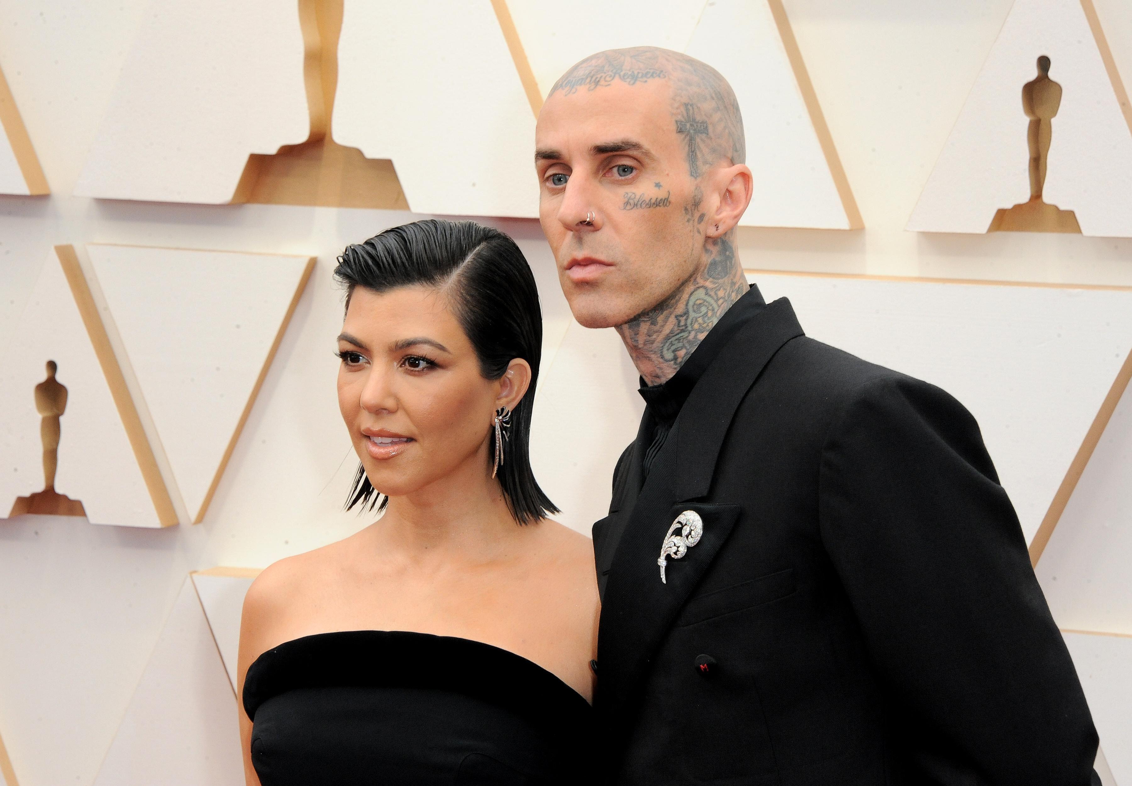 Travis Barker, the partner of Kourtney Kardashian, is famed for his facial tattoos (Alamy/PA)