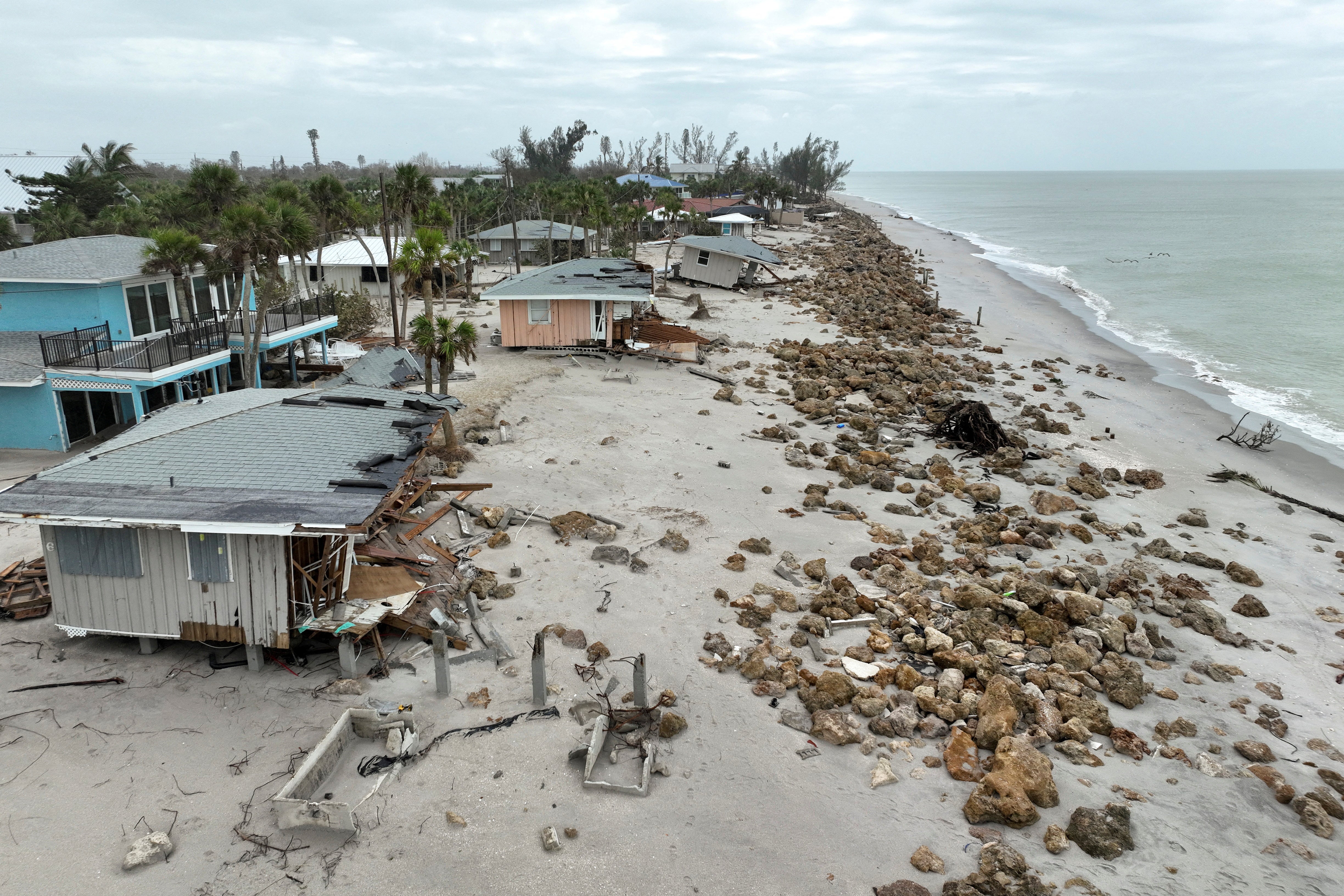 A drone shot shows decimated Florida beach houses after Hurricane Milton made landfall in the state earlier this month. The risk of tropical activity could extend into December, forecasters say