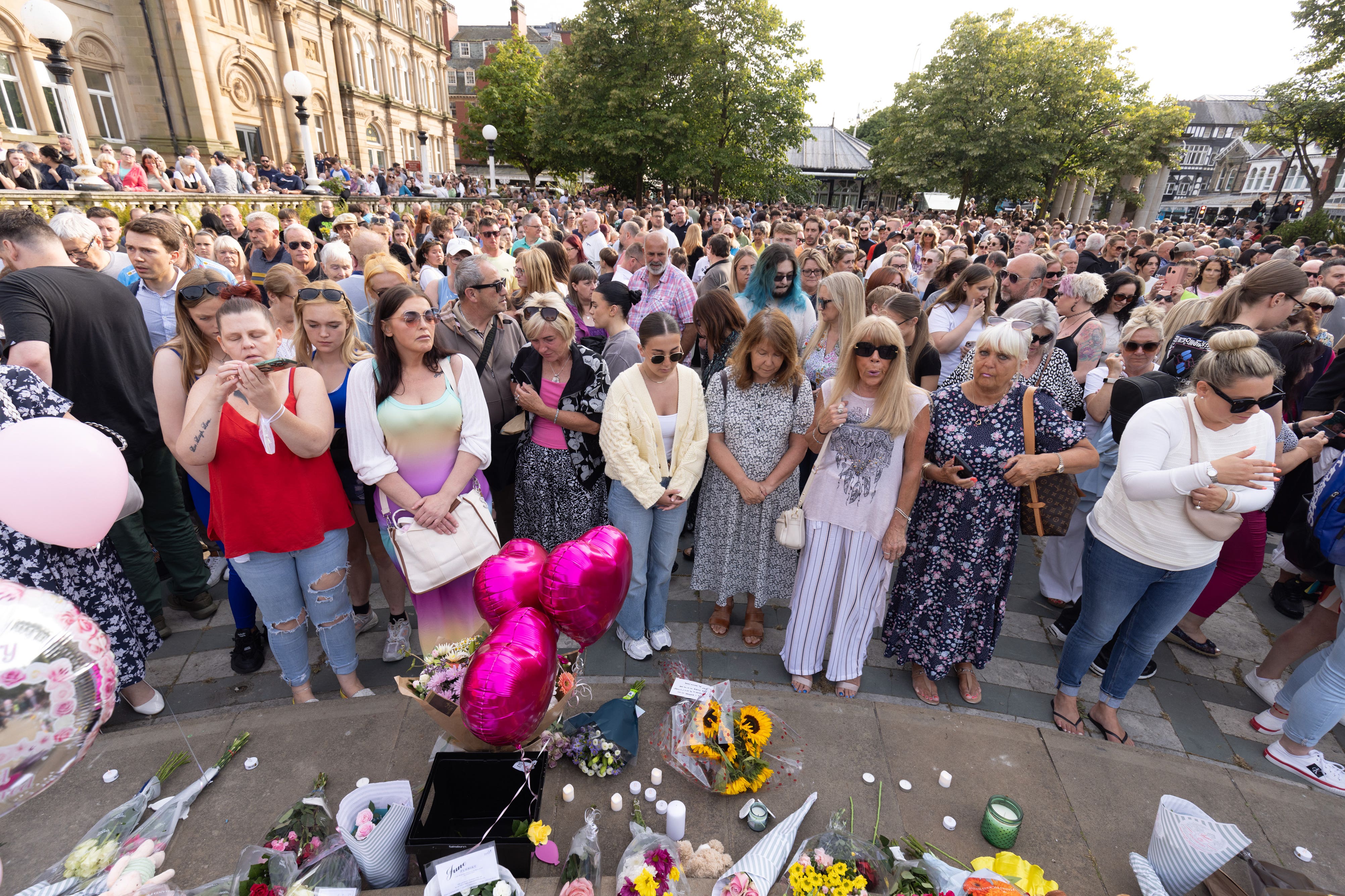 Members of the public take part in a vigil in Southport in July (James Speakman/PA)