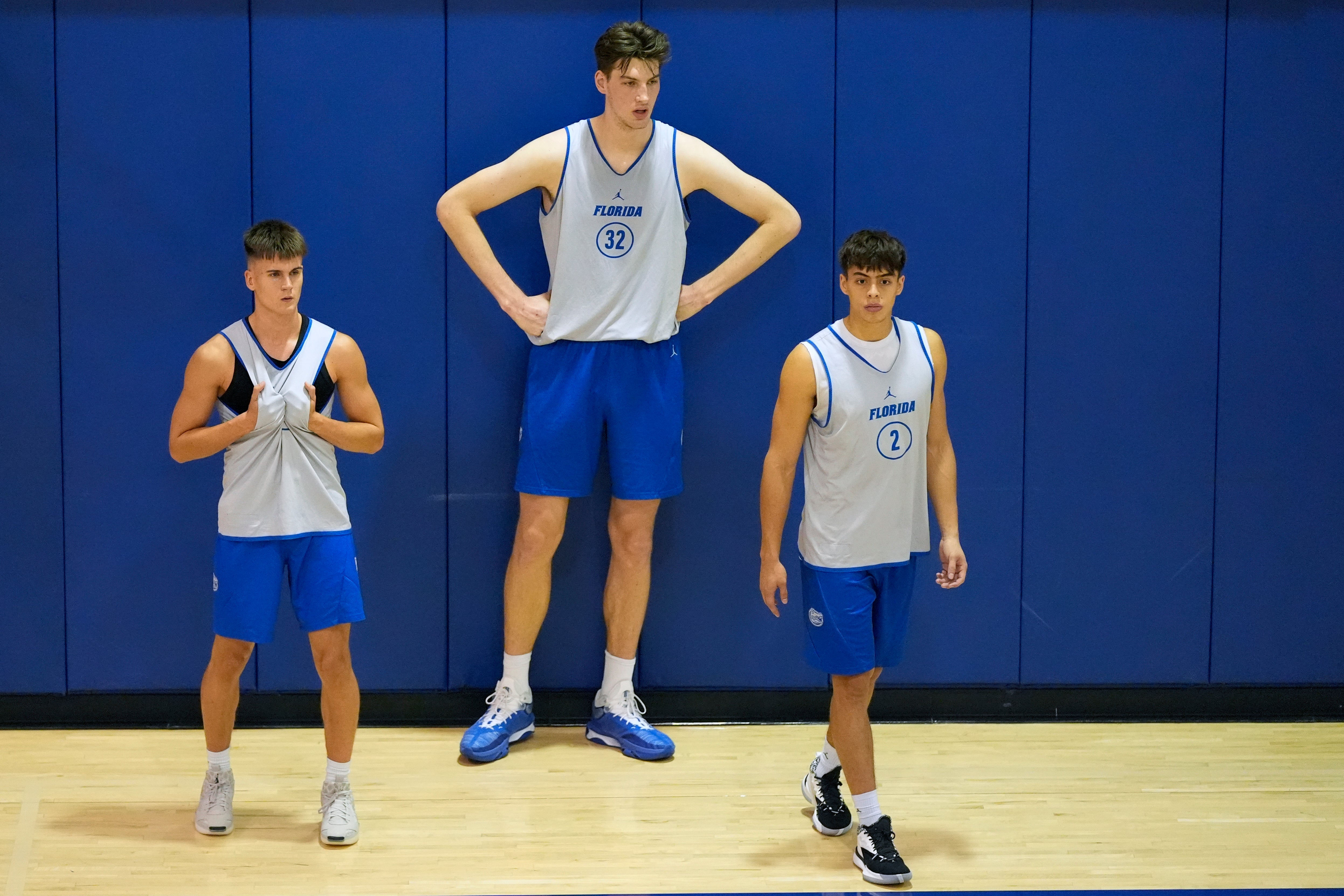 Olivier Rioux, center, a 7-foot-9 NCAA college basketball player at Florida