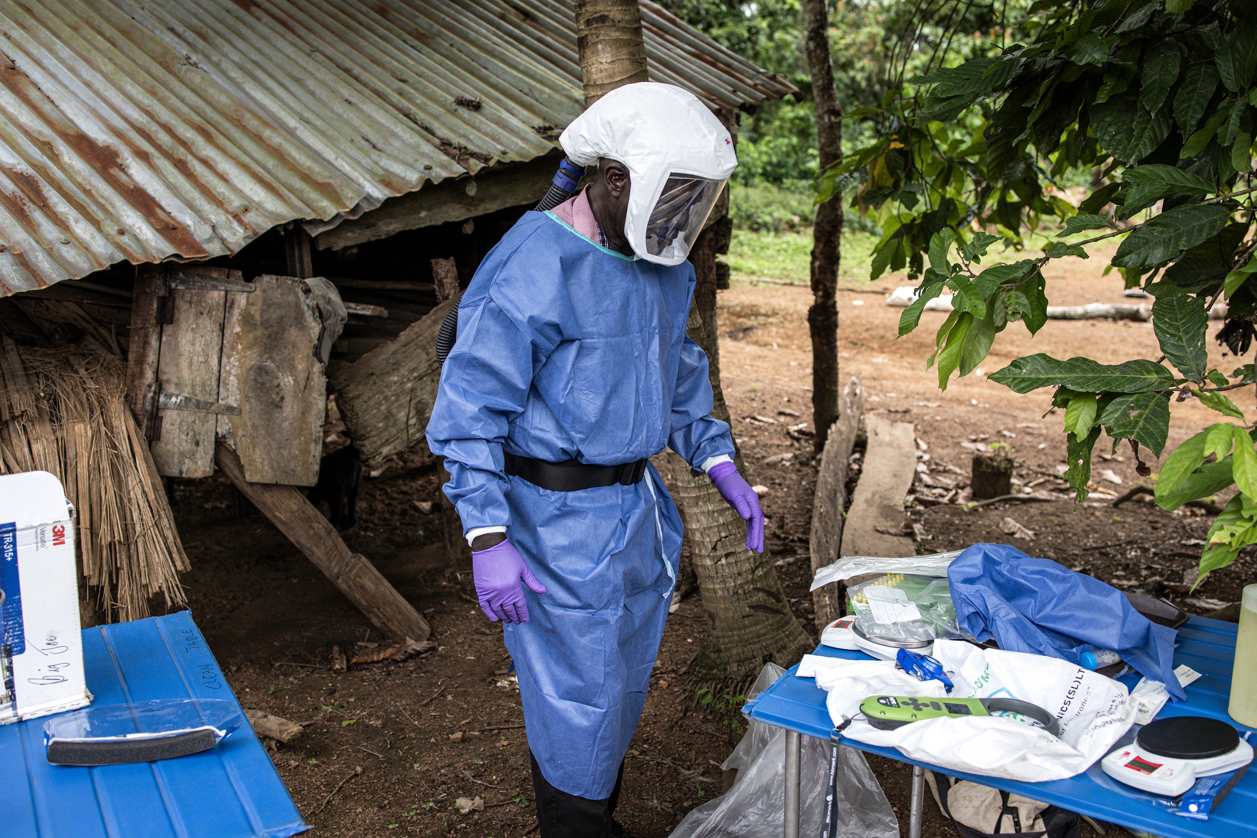 James Koninga, head of the ecology team at the Kenema Government Hospital in Sierra Leone is seen with his personal protective equipment in Mapuma village outside Kenema on June 12, 2024. Researchers are studying Lassa fever, a viral hemorrhagic disease endemic to several West African countries and transmitted by rodents