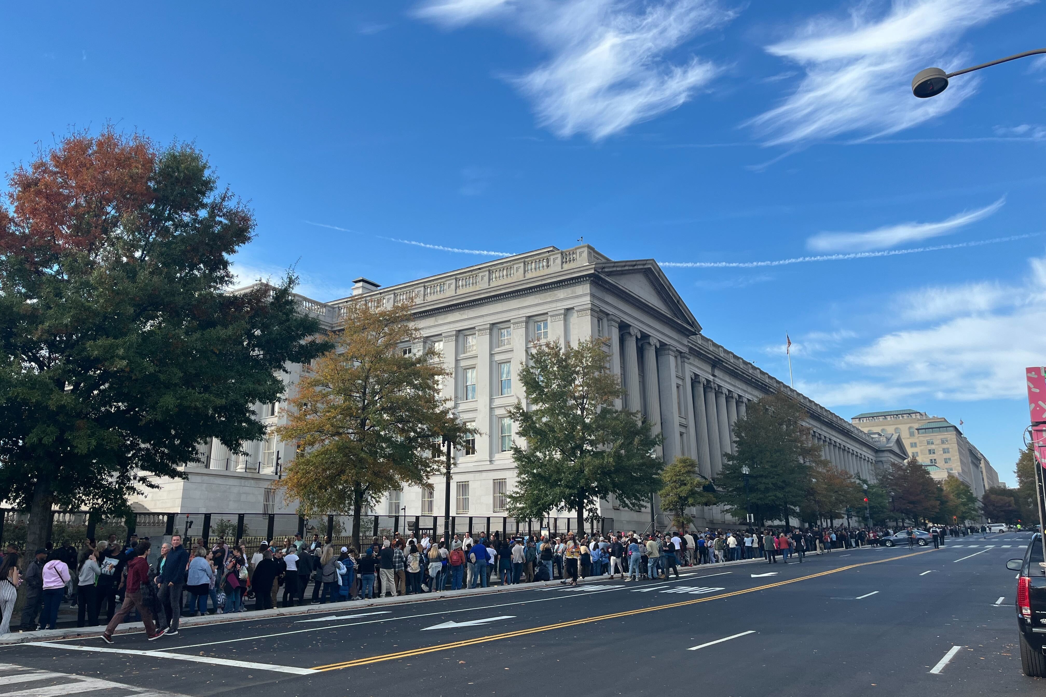 A long line forms for Kamala Harris’ rally at the Ellipse in Washington DC, three hours before her remarks are due to begin