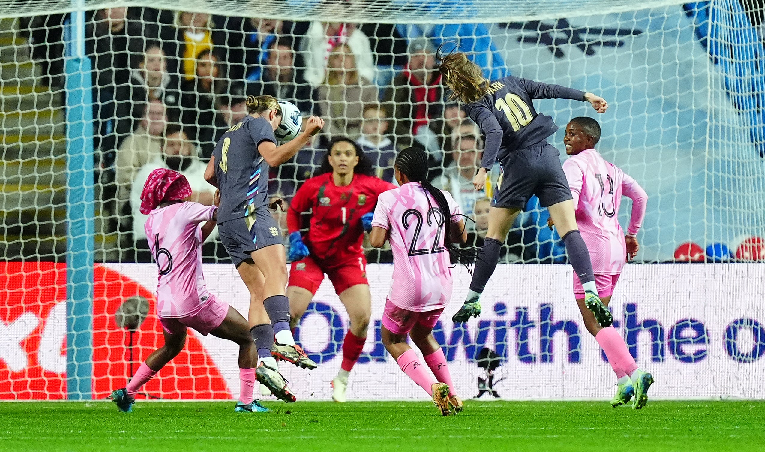 Grace Clinton, second left, heads home England’s second goal