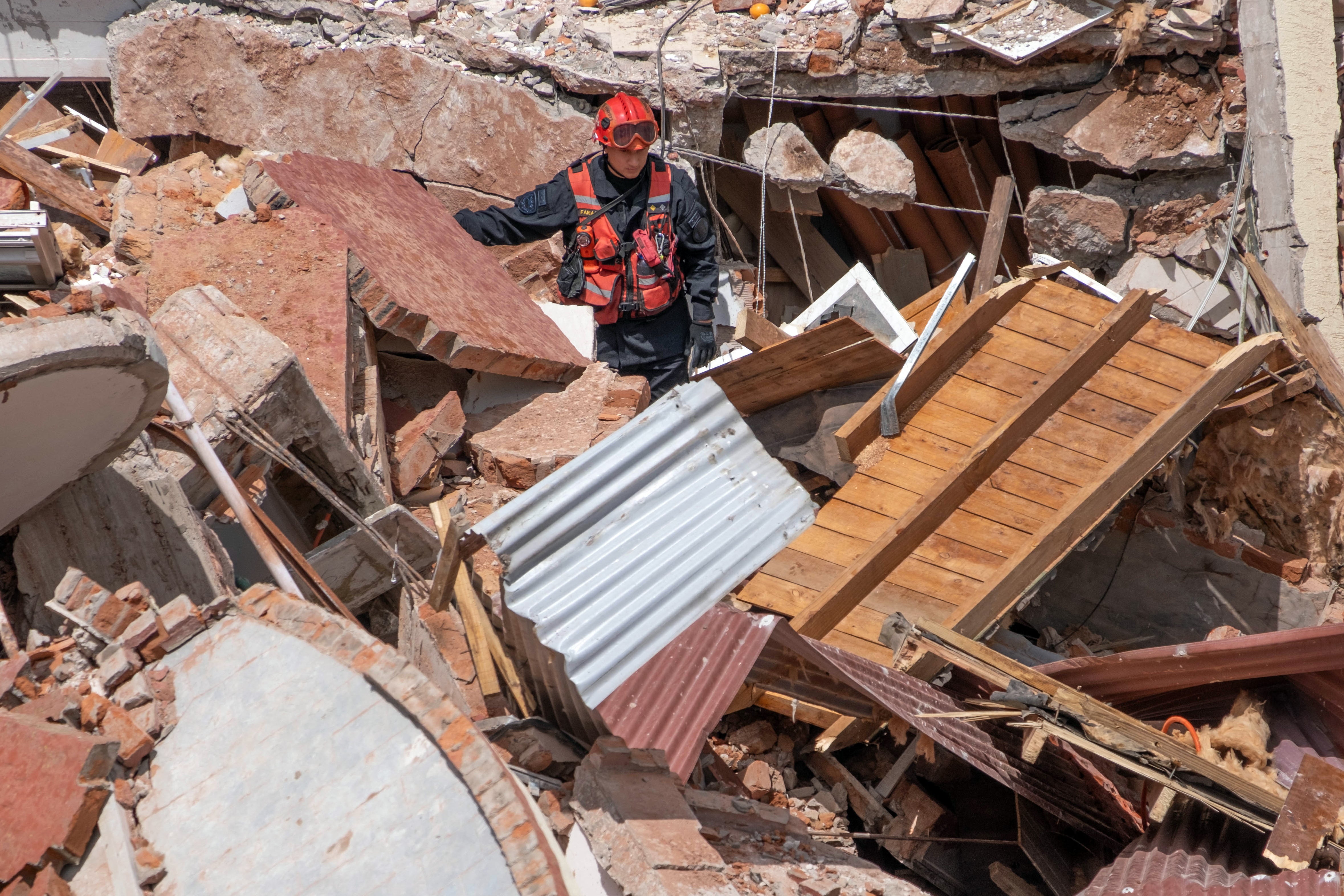 An elderly man was killed and several are missing after a ten-storey building housing a hotel collapsed on Tuesday