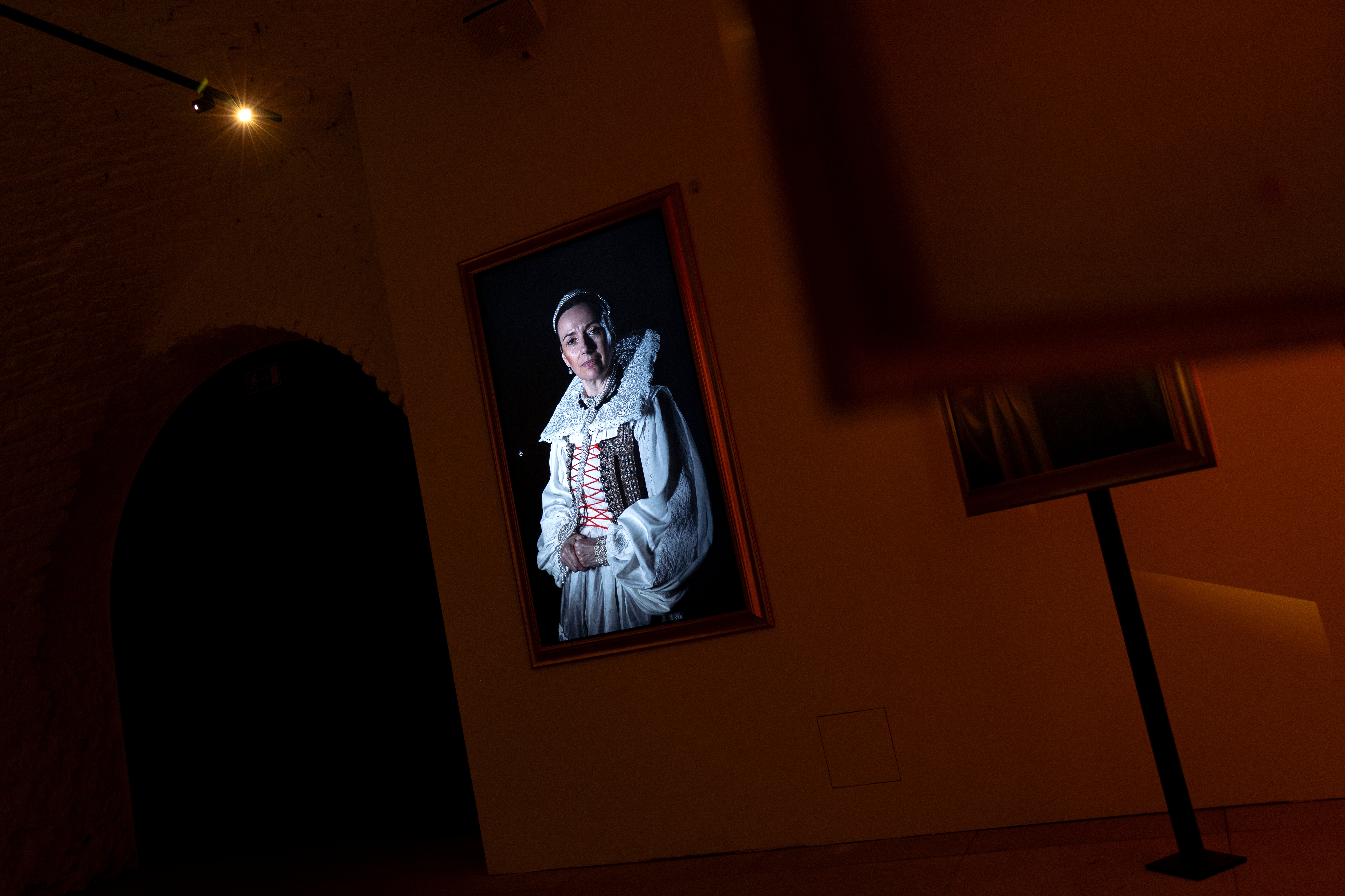 A screen showing an actress reenacting Elizabeth Bathory in the Draskovic museum in Cachtice