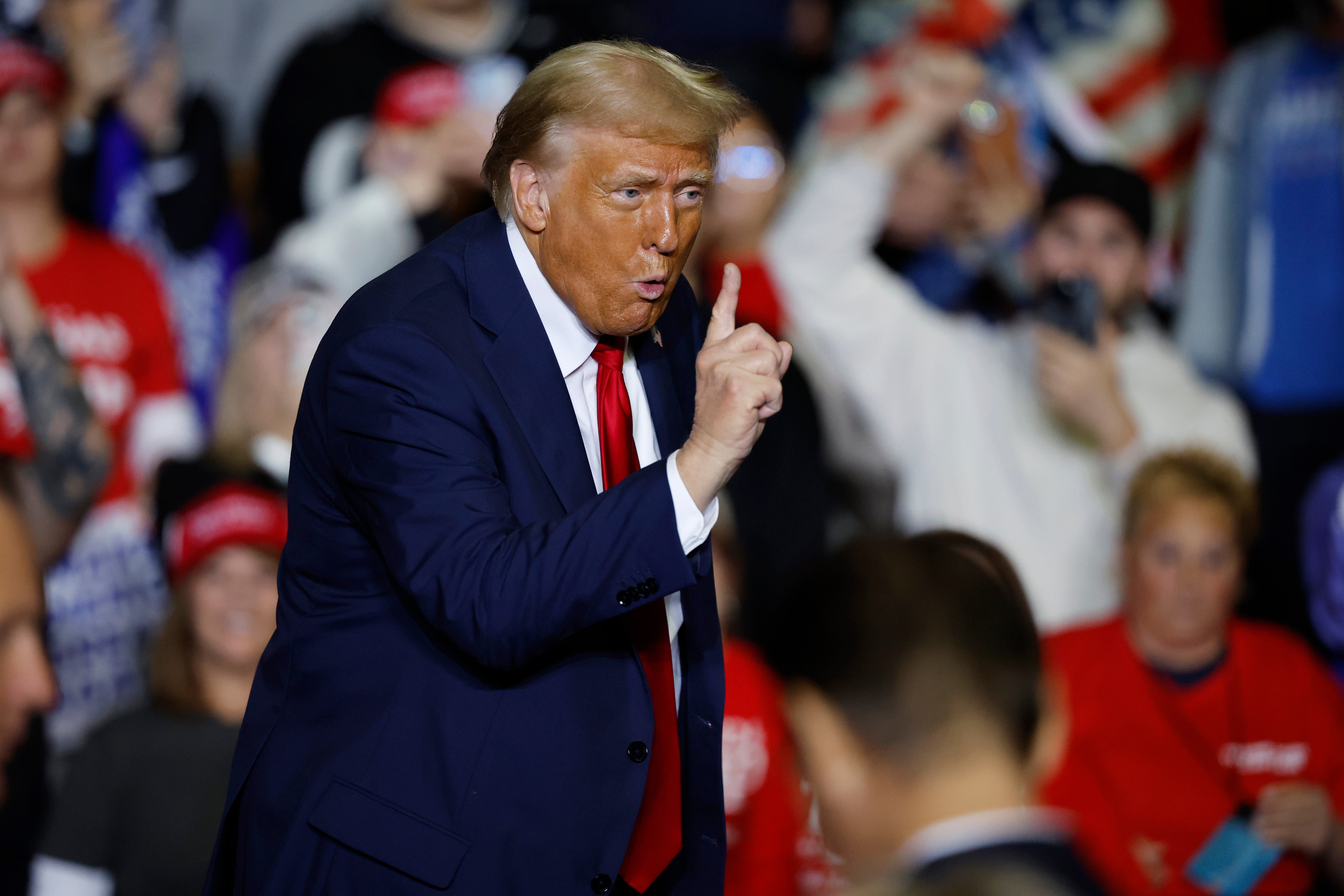 Trump gestures at a campaign rally at The PPL Center on October 29, 2024 in Allentown, Pennsylvania. At the event, he repeated his line calling the US a ‘garbage can’