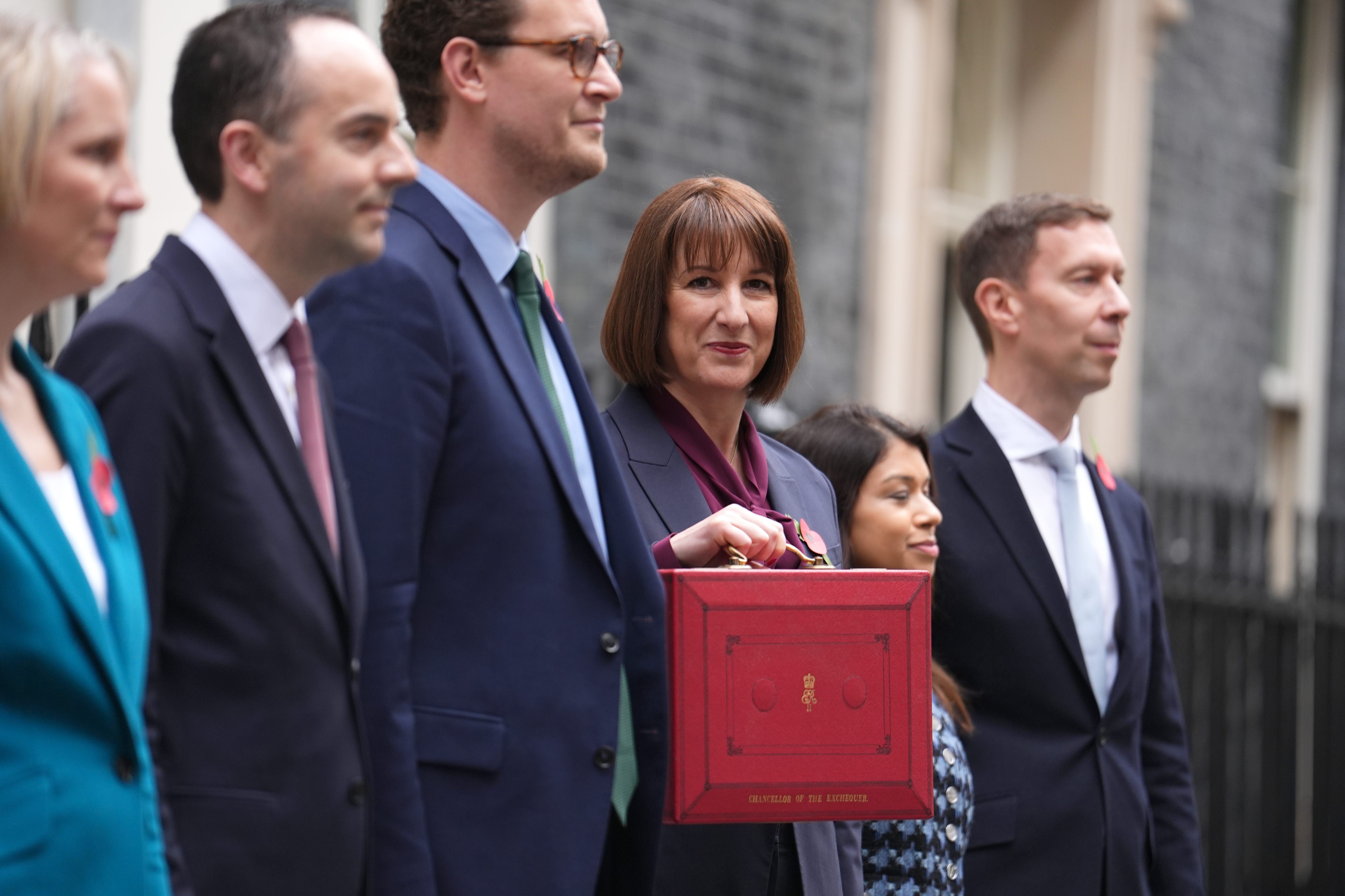 Chancellor of the Exchequer Rachel Reeves poses outside 11 Downing Street with her team ahead of delivering her first Budget (Jordan Pettitt/PA)