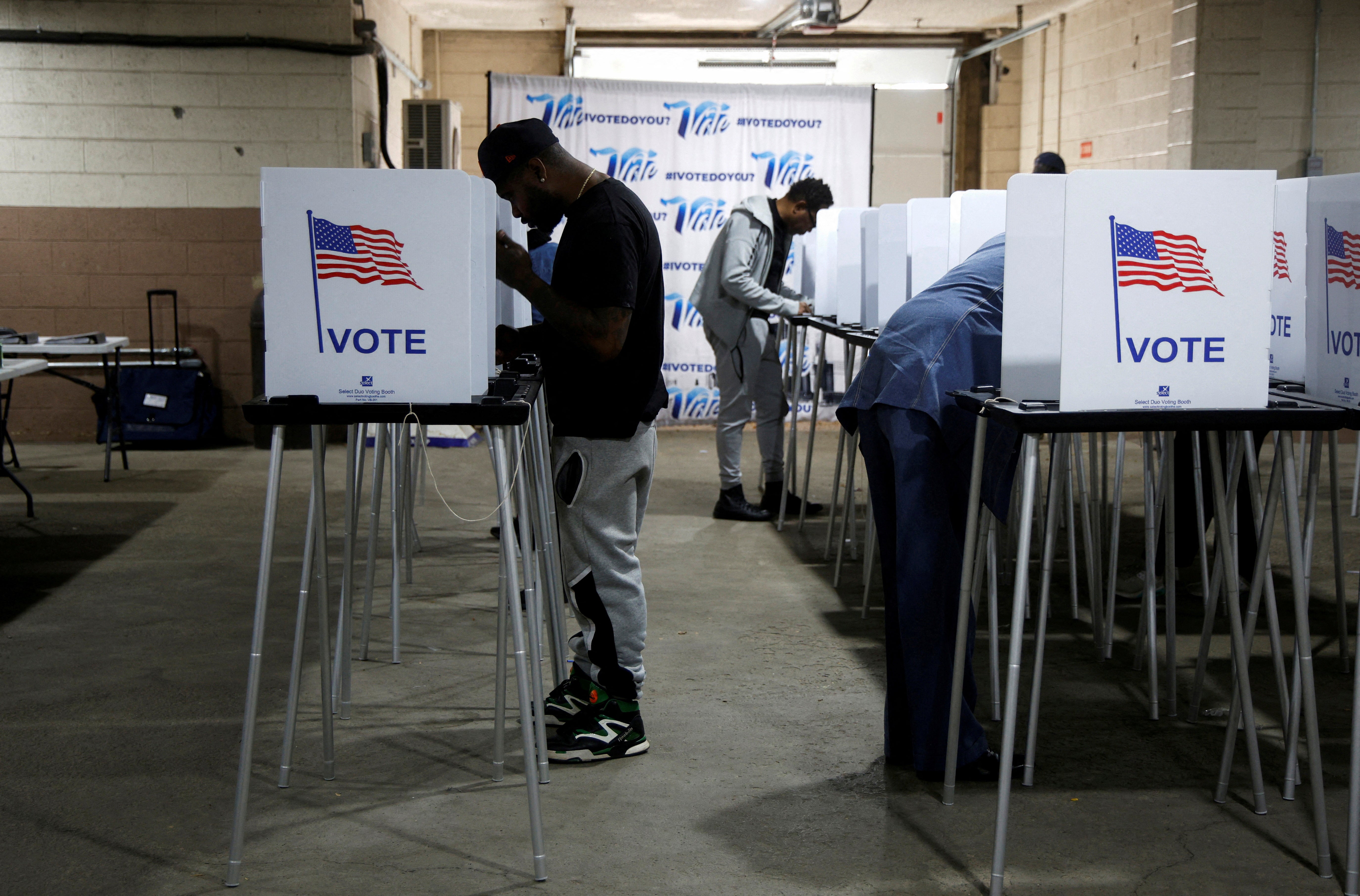 Voters fill out ballots for the presidential election in Detroit on Monday. The Great Lakes region could experience rain on Election Day, which could lead to lower voter turnout