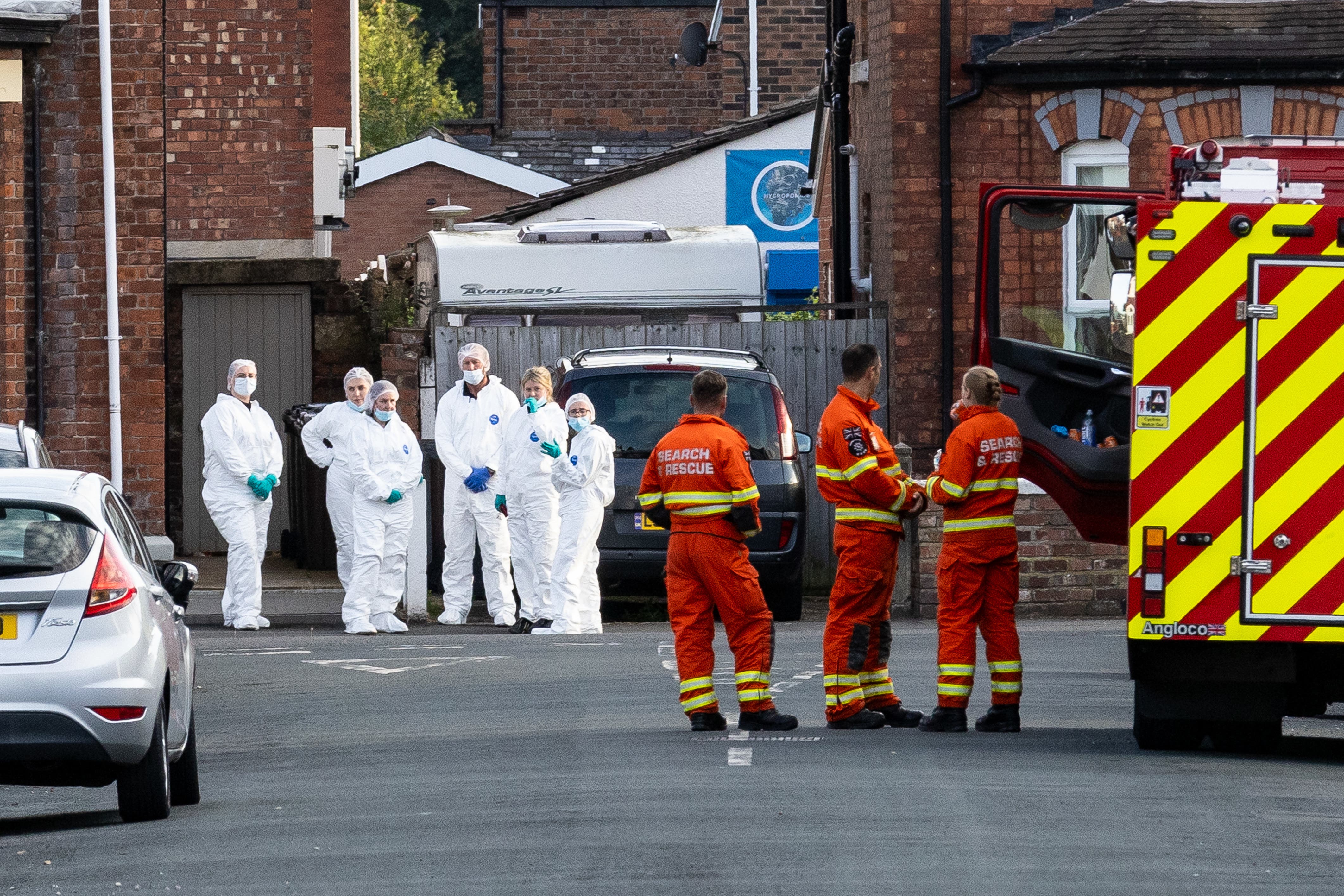 Emergency services working at the scene of the Southport attack in July (James Speakman/PA)