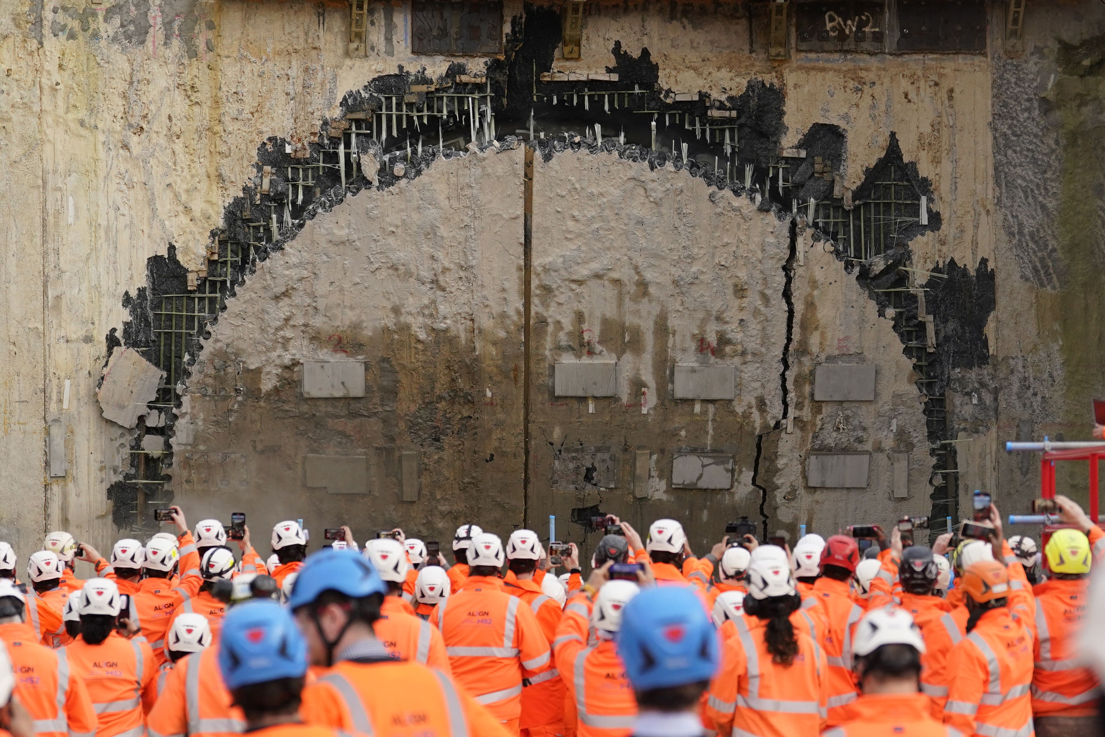 HS2 workers look on as the boring machine Cecelia breaks through after digging the longest tunnel in the HS2 project earlier this year (PA)