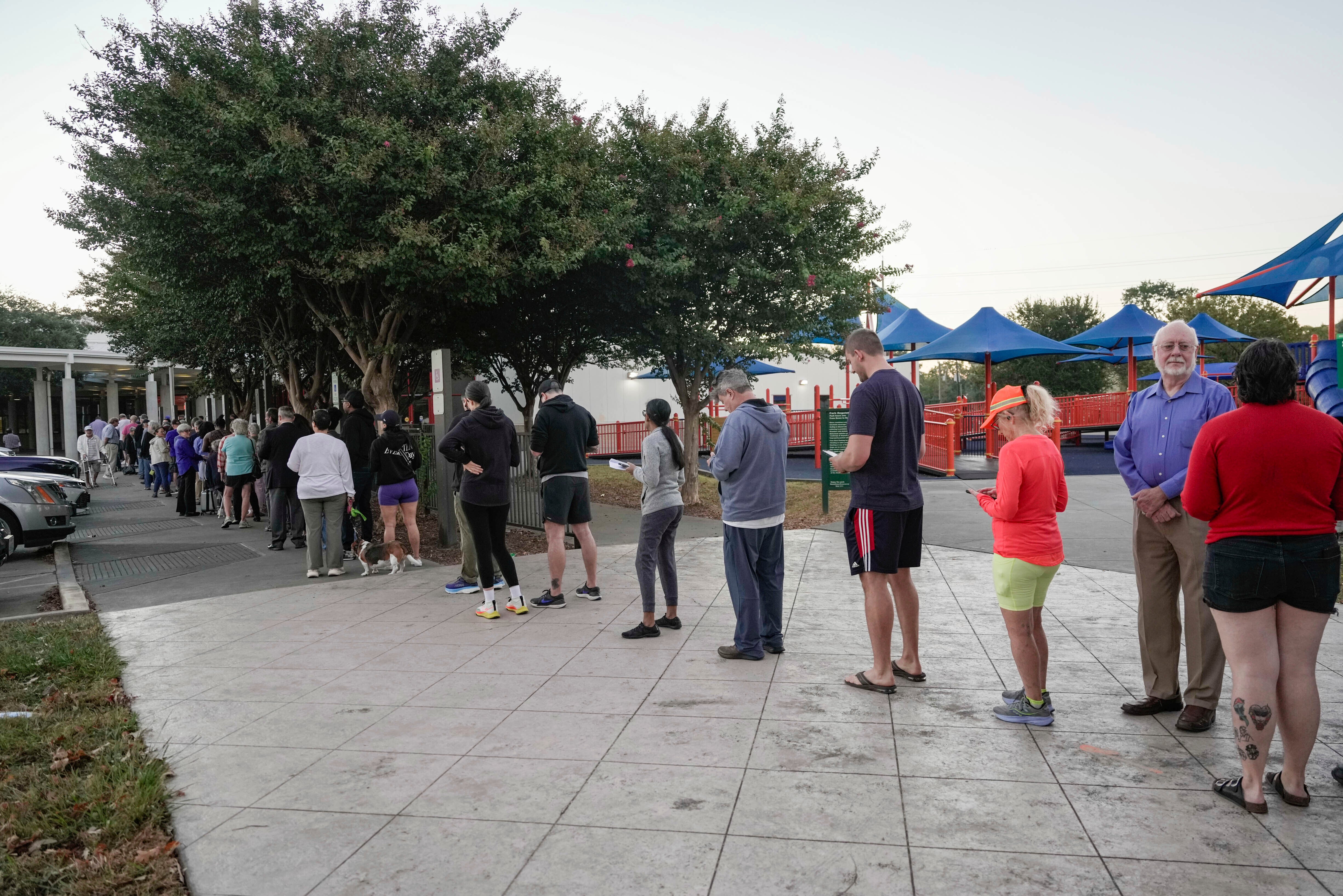 People wait in line for early voting in Houston last week. Texas is one of several states that could see significant rain and flooding through Election Day