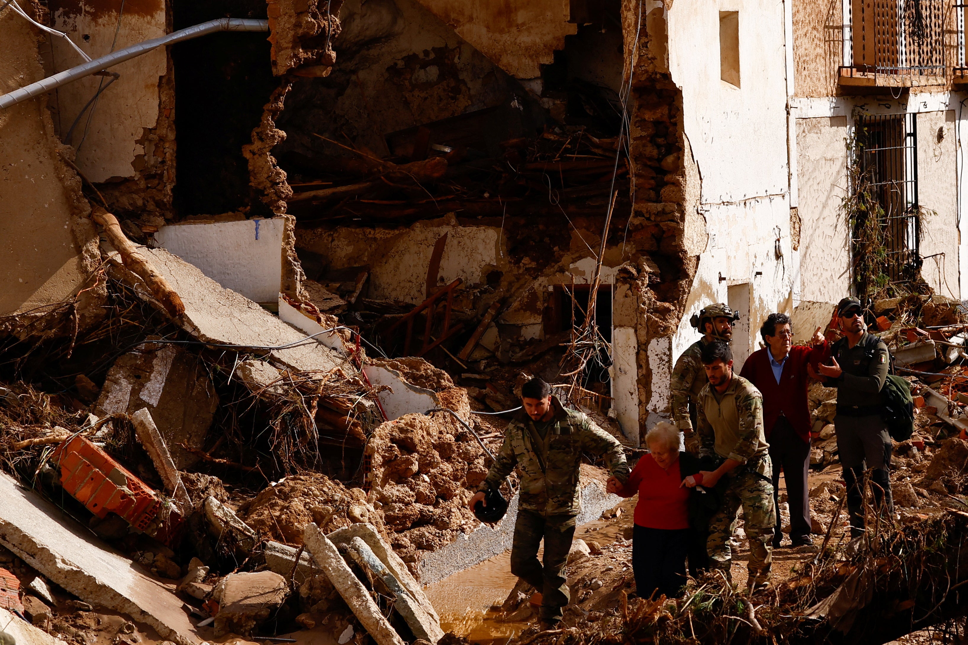 Encarna Rivero, 88, and her husband Jose Tomas, 89, are rescued after being stranded at a neighbour’s home