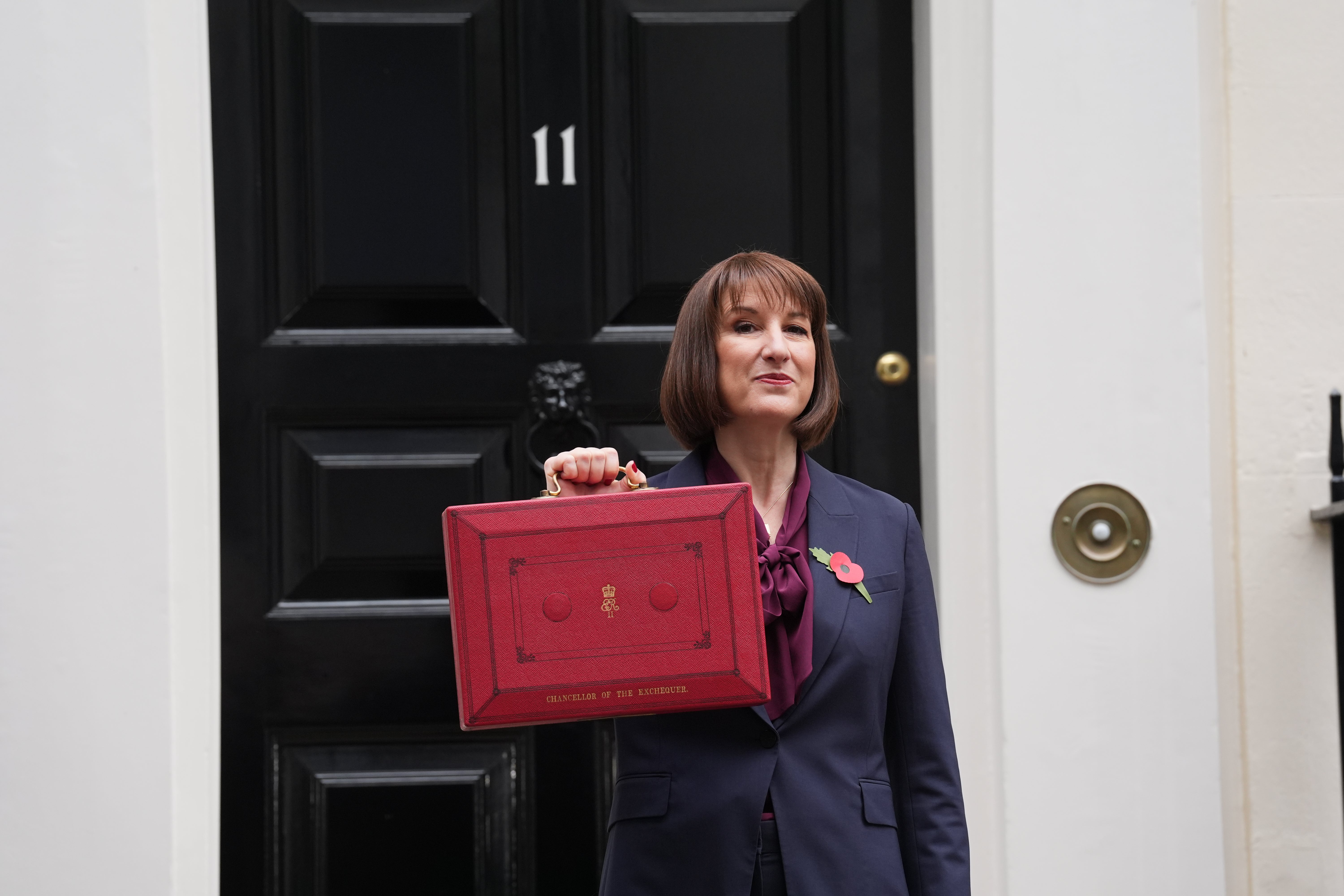 Chancellor Rachel Reeves outside 11 Downing Street with her ministerial red box before delivering her Budget in the Houses of Parliament (Lucy North/PA)