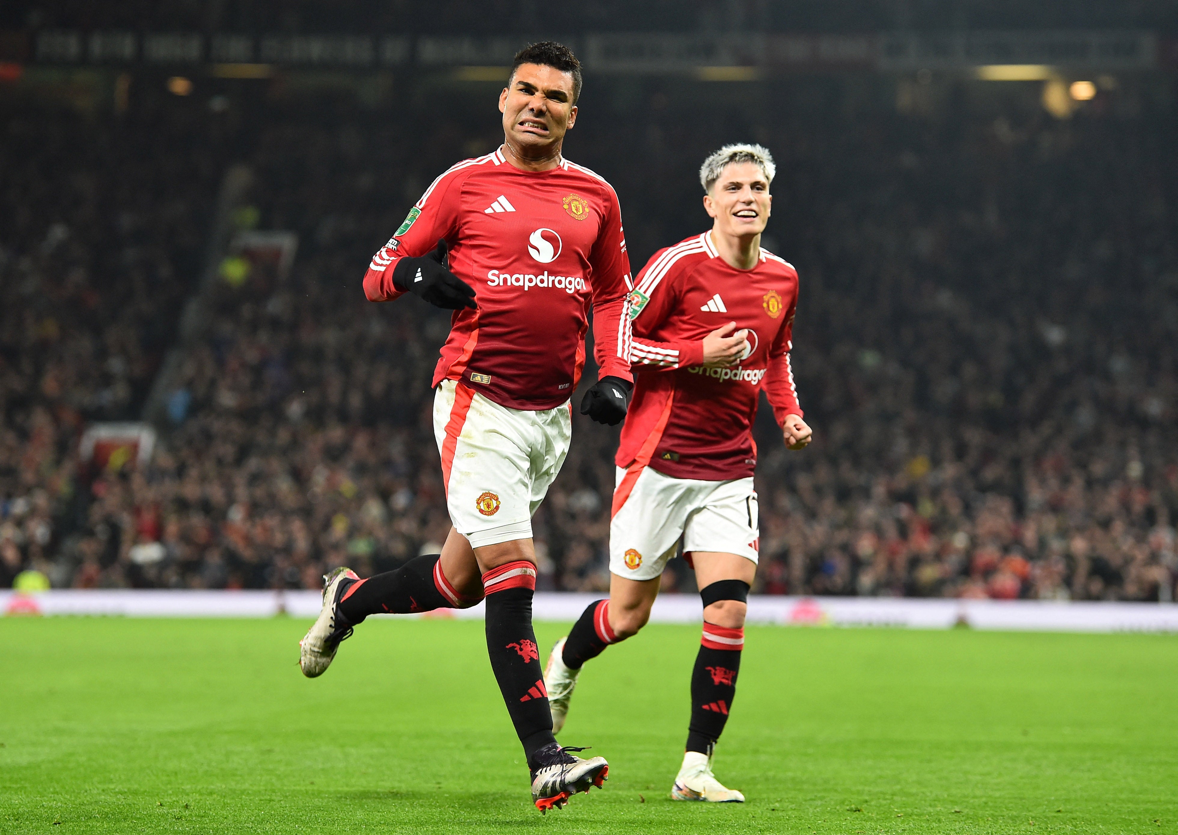 Manchester United's Casemiro celebrates scoring their first goal with Alejandro Garnacho