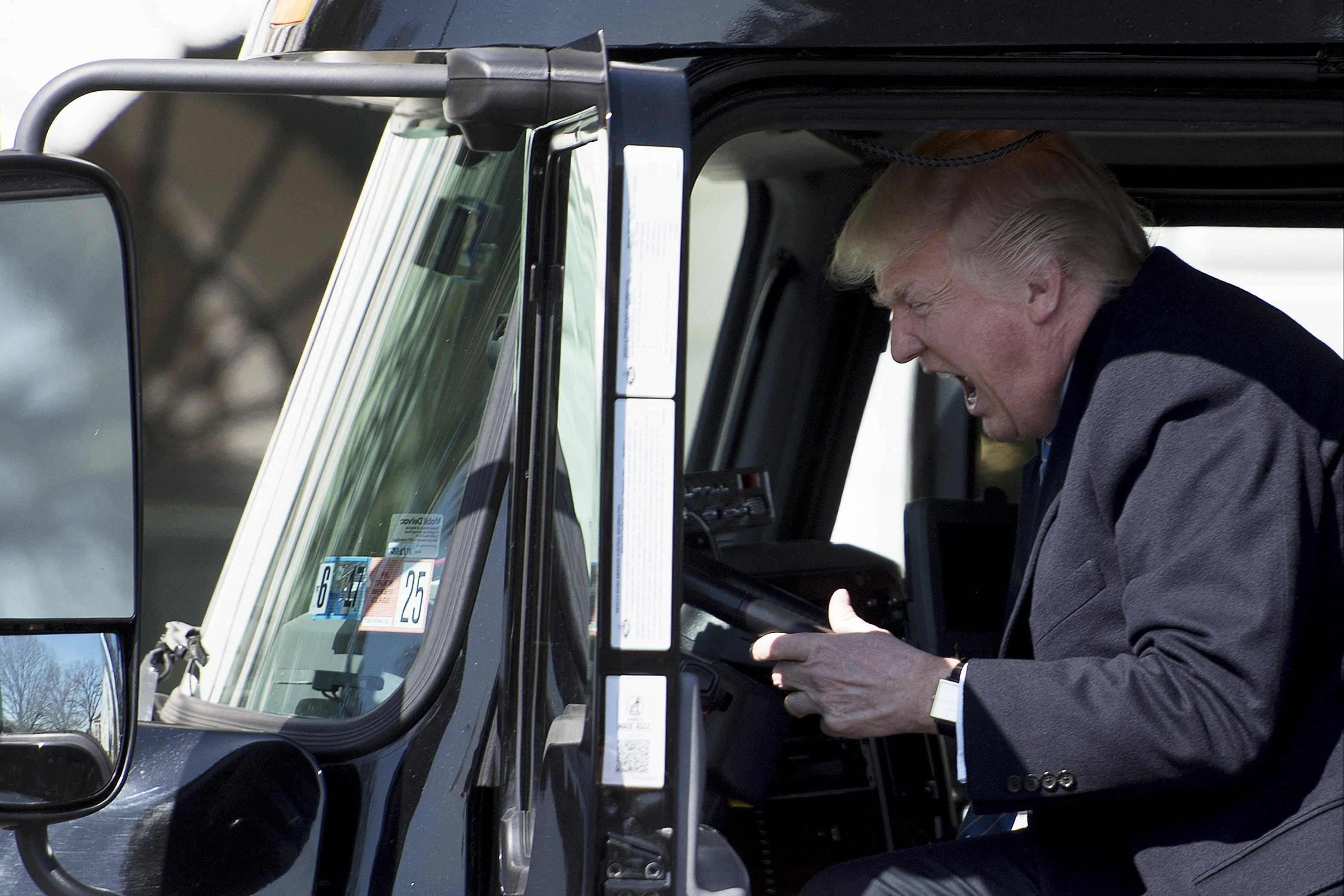 Trump is well known for loving to sit in trucks. Here he is pictured in the driver’s seat of a semi-truck as he welcomes truckers and CEOs to the White House in March 23 2017, to discuss healthcare