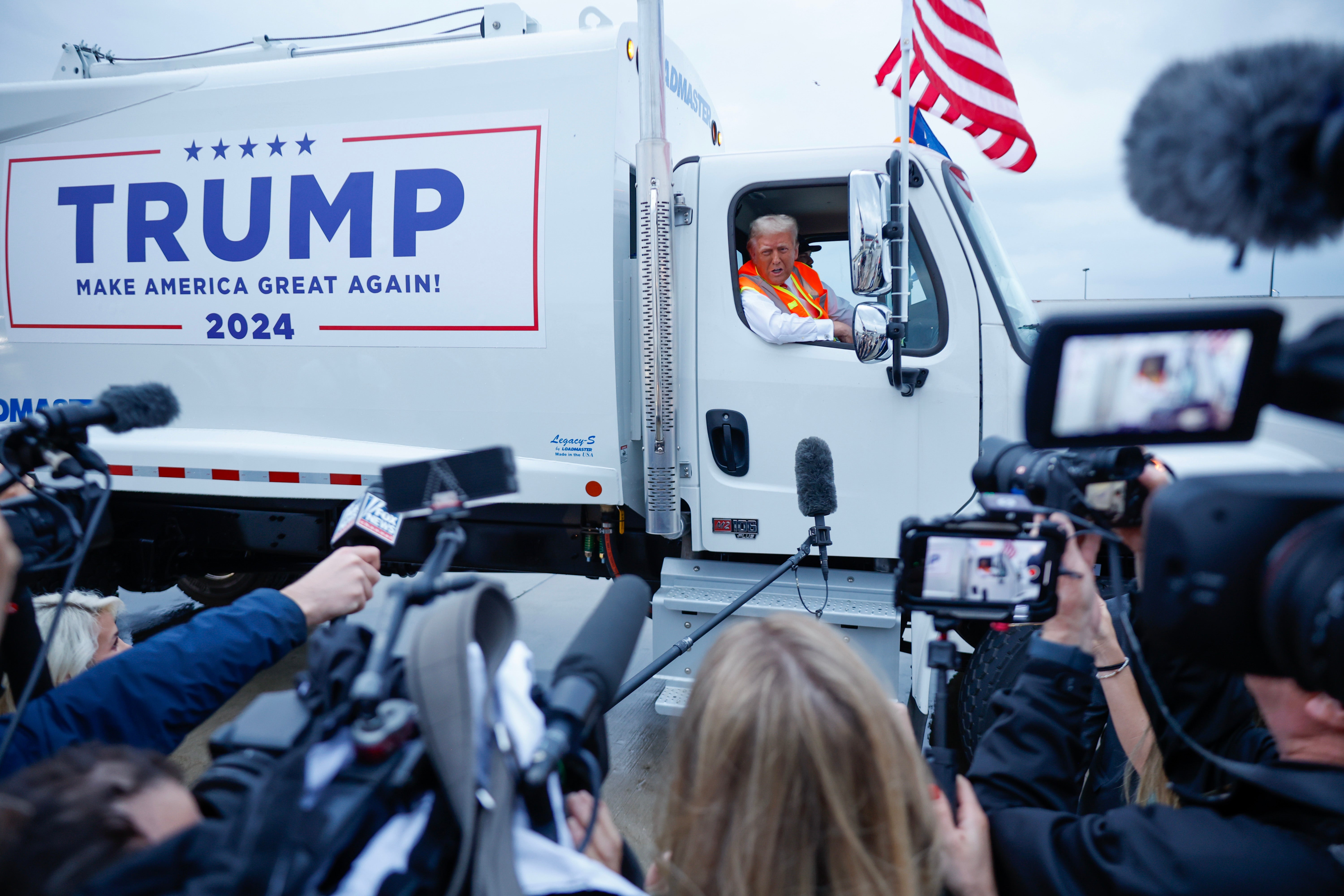 Donald Trump holds a press conference from inside a Trump-branded trash hauler at Green Bay Austin Straubel International Airport