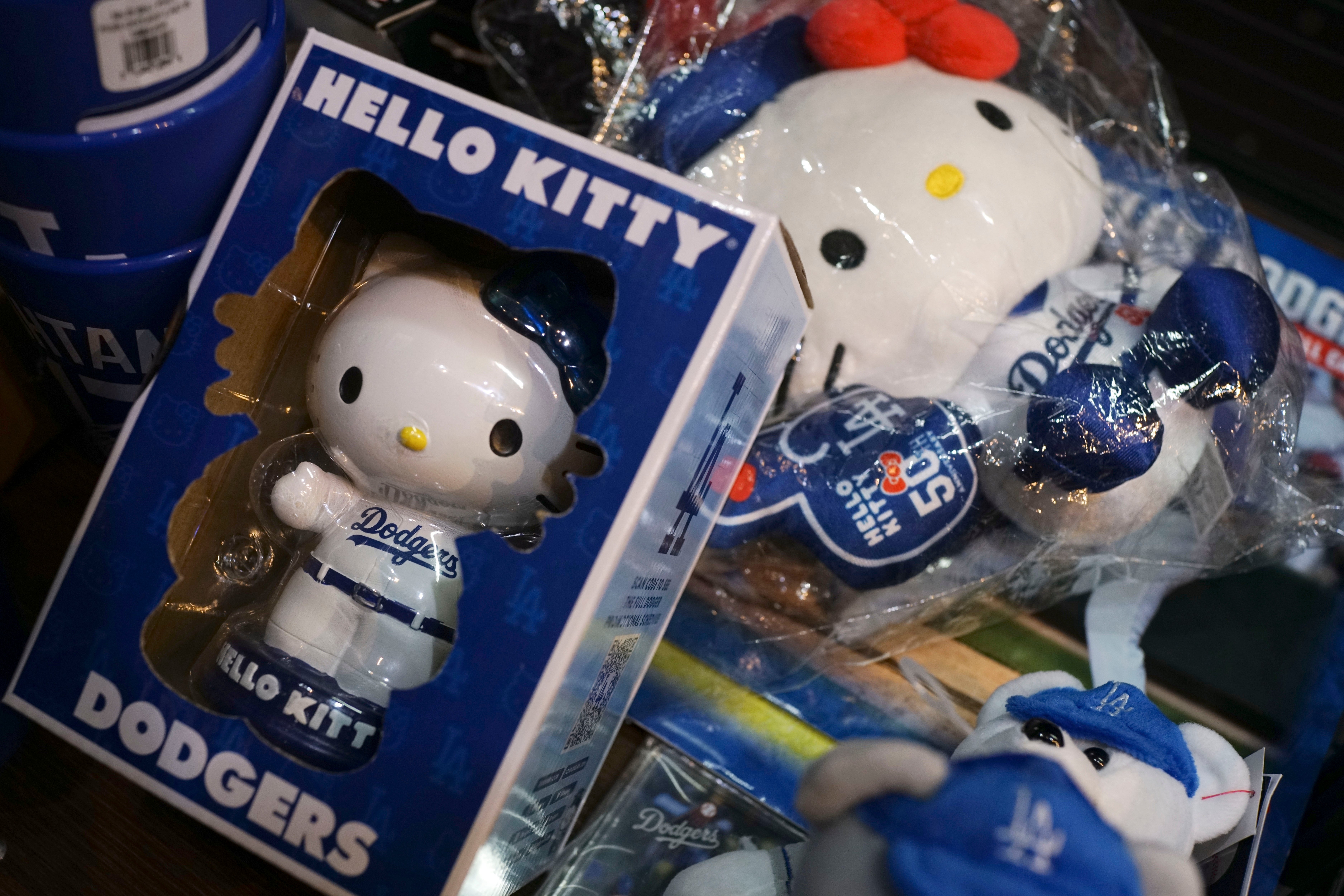 The 50th anniversary Hello Kitty dolls with Los Angeles Dodgers uniform are sold at a shop