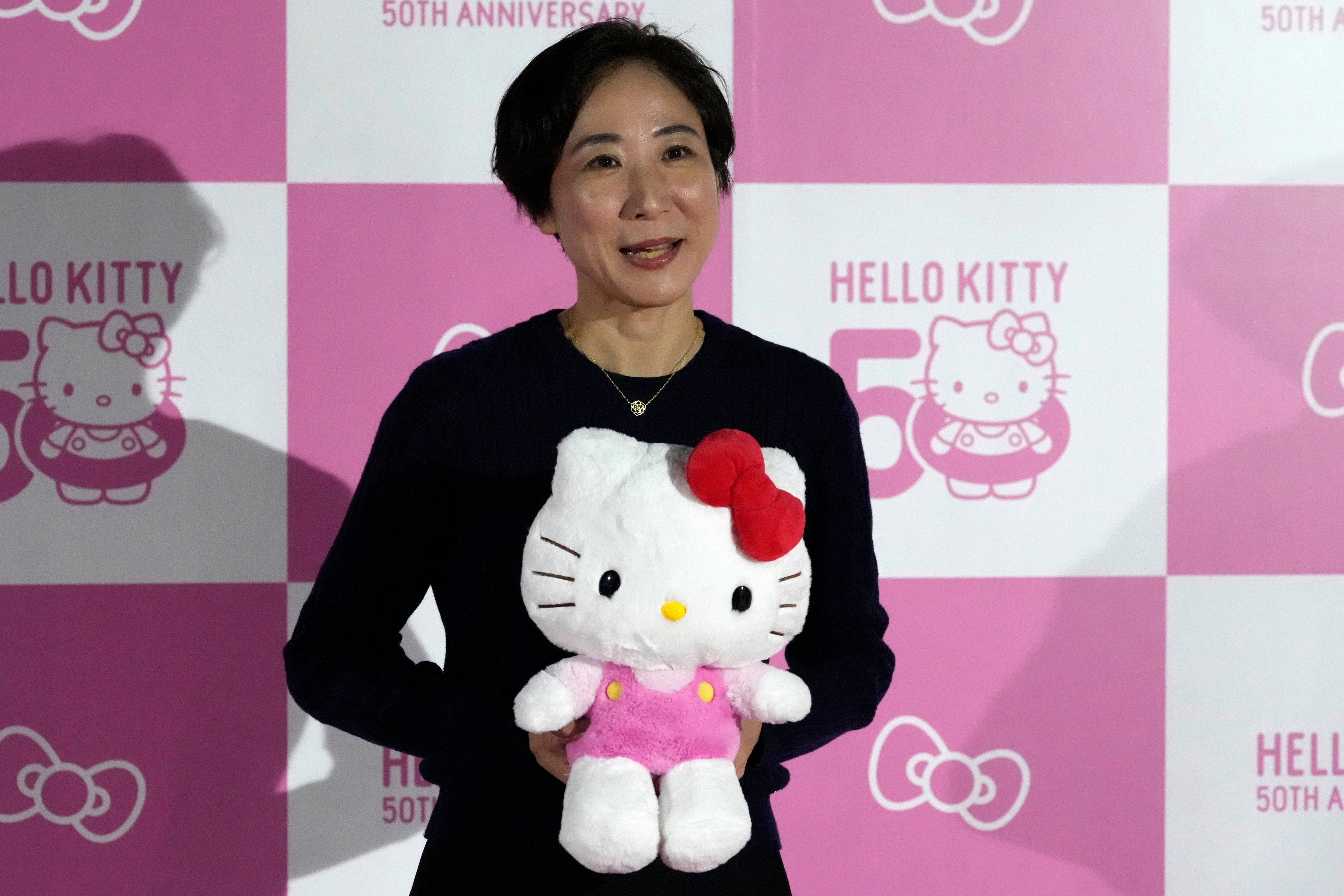 Yuko Akiyama, one of the directors at Sanrio, speaks to the media during the exhibition