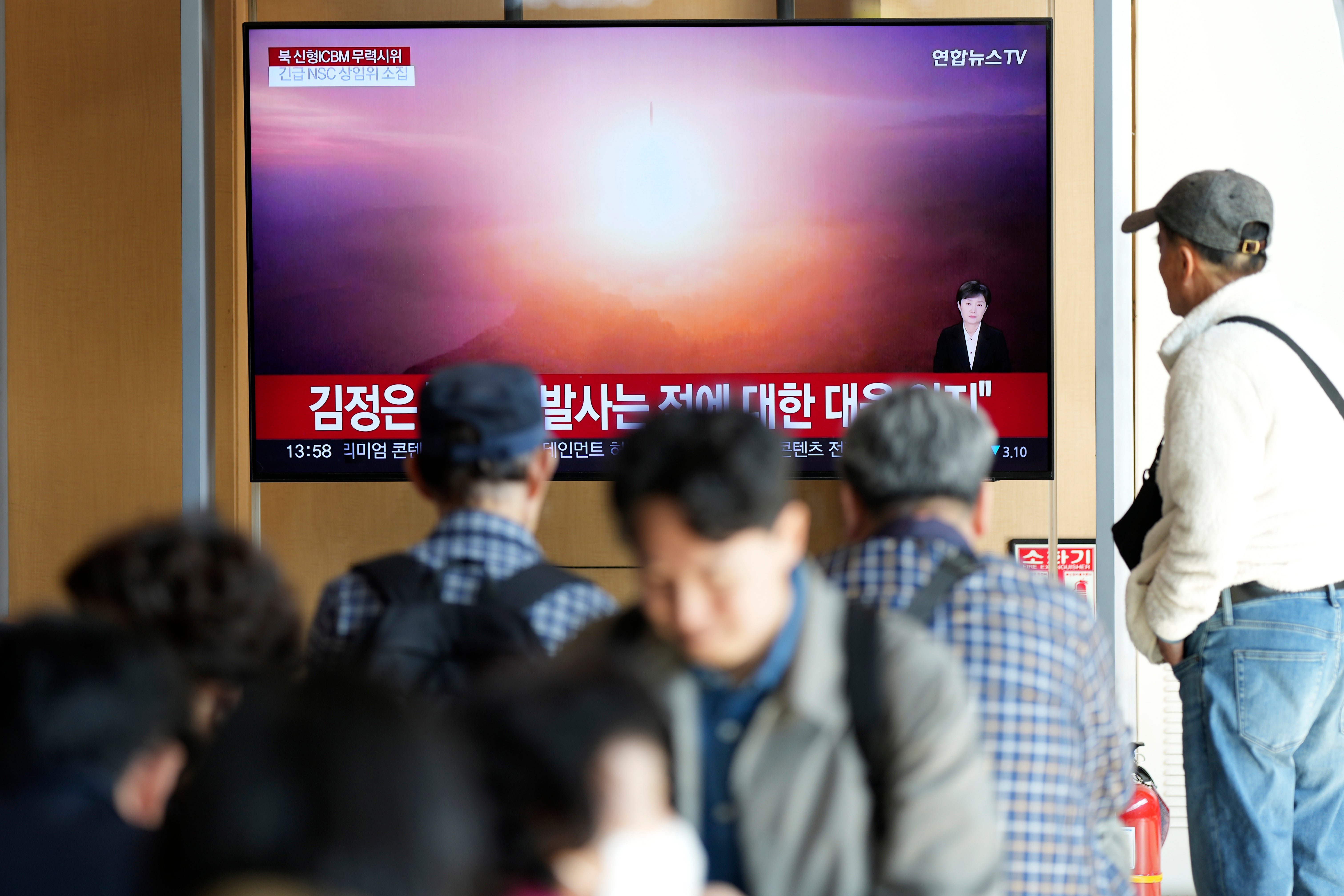 A TV screen shows the test launch of a North Korean intercontinental ballistic missile in Seoul, South Korea, on 31 October 2024.