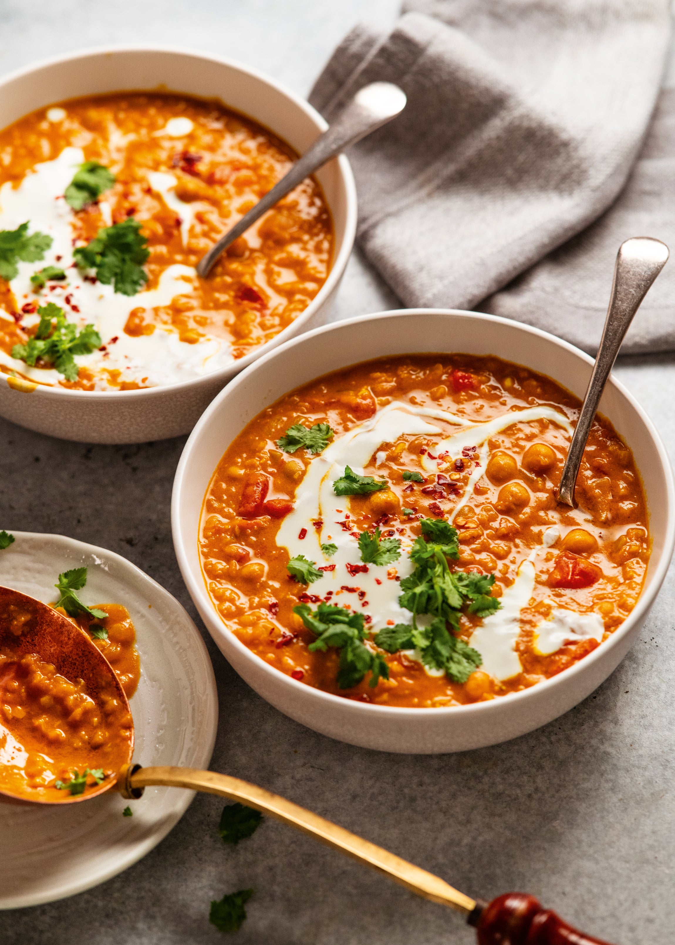 Warm and hearty, this versatile stew can be enjoyed as a soup or over rice, loaded with coconut and spices for a nourishing meal