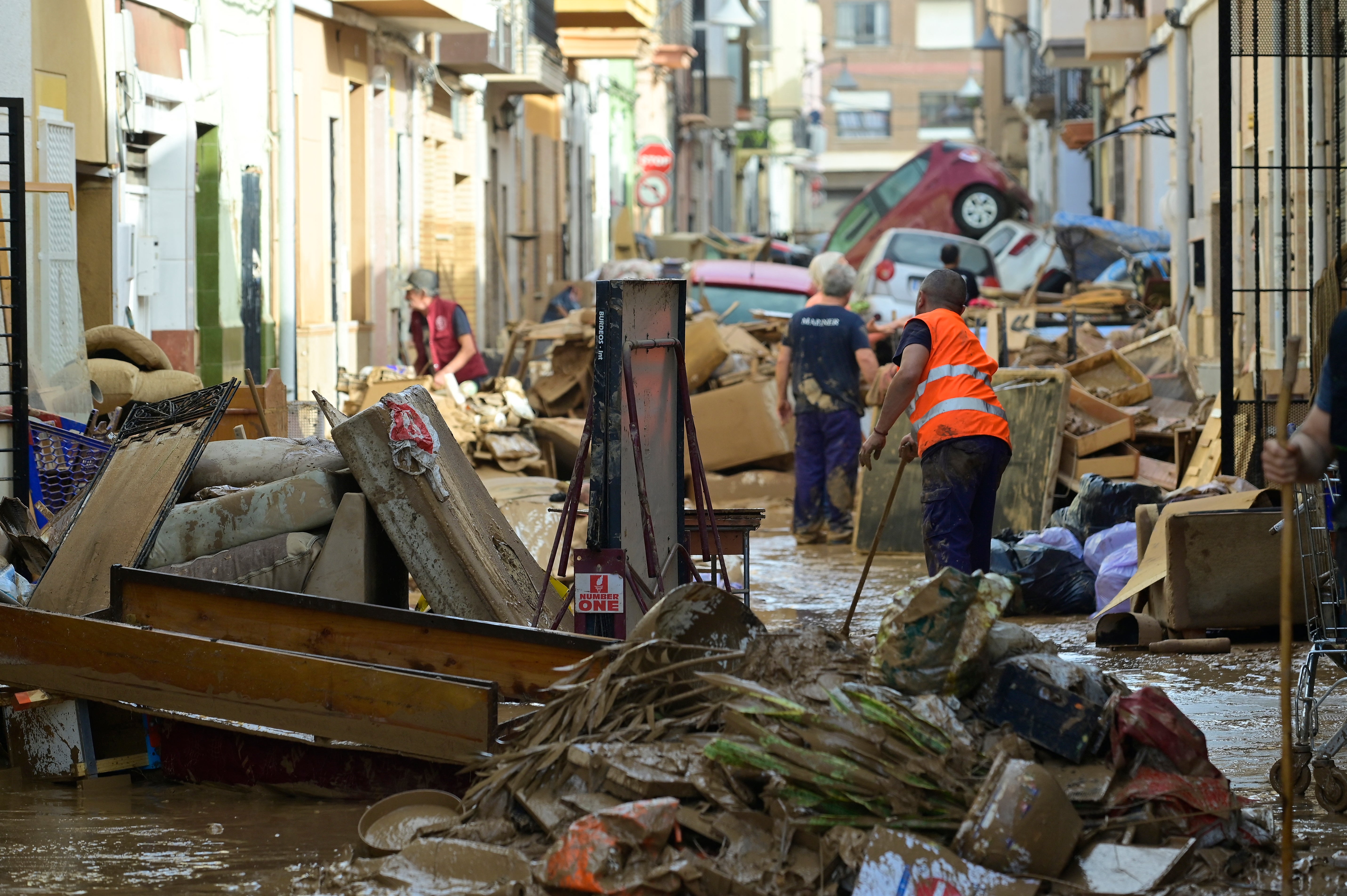 Residents try to clean their houses in the Valencia town of Alfafara