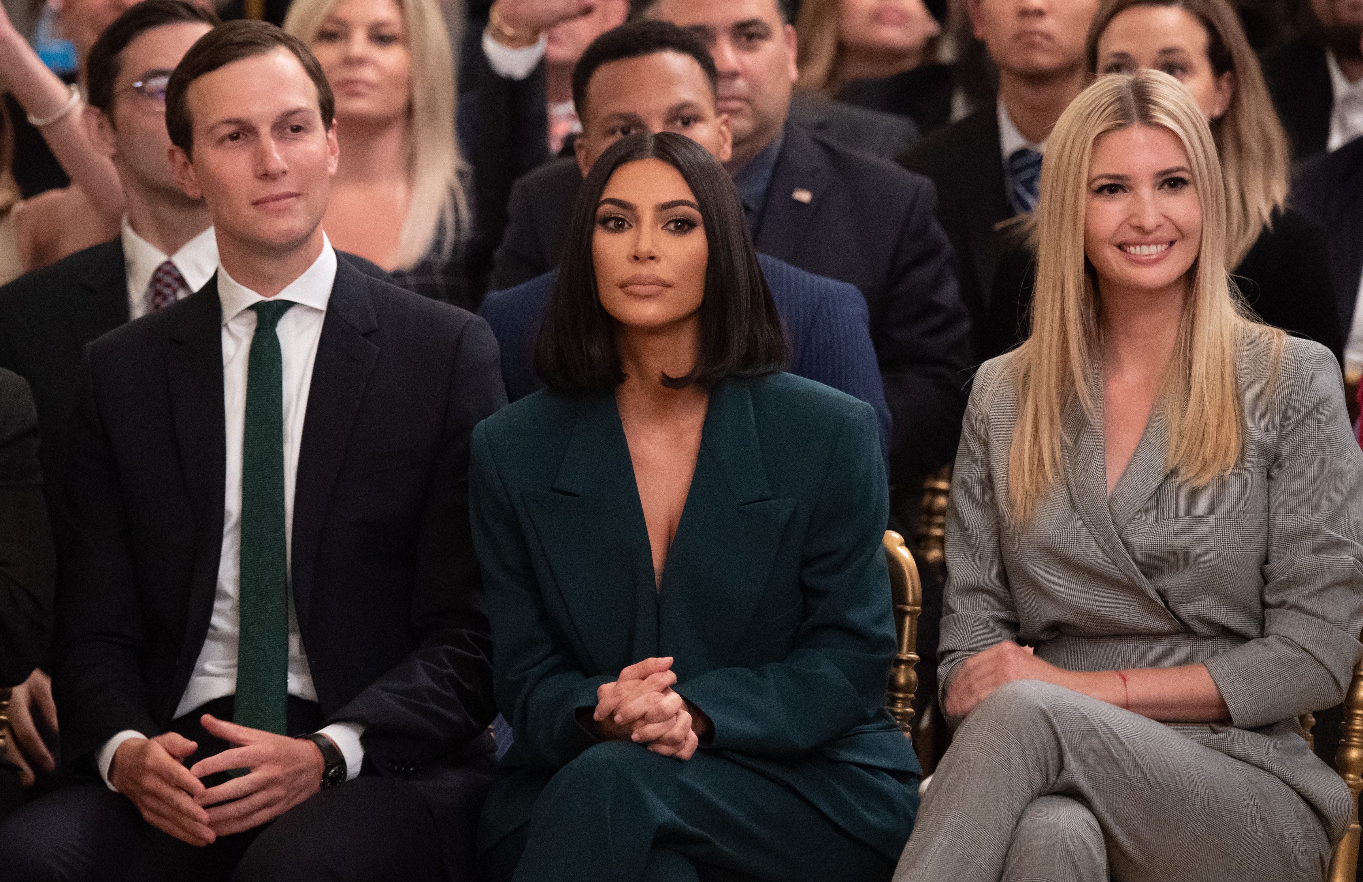 Kim Kardashian (center) with Ivanka Trump (right) and Jared Kushner listening to Donald Trump speakng about second chance hiring and criminal justice reform in 2019