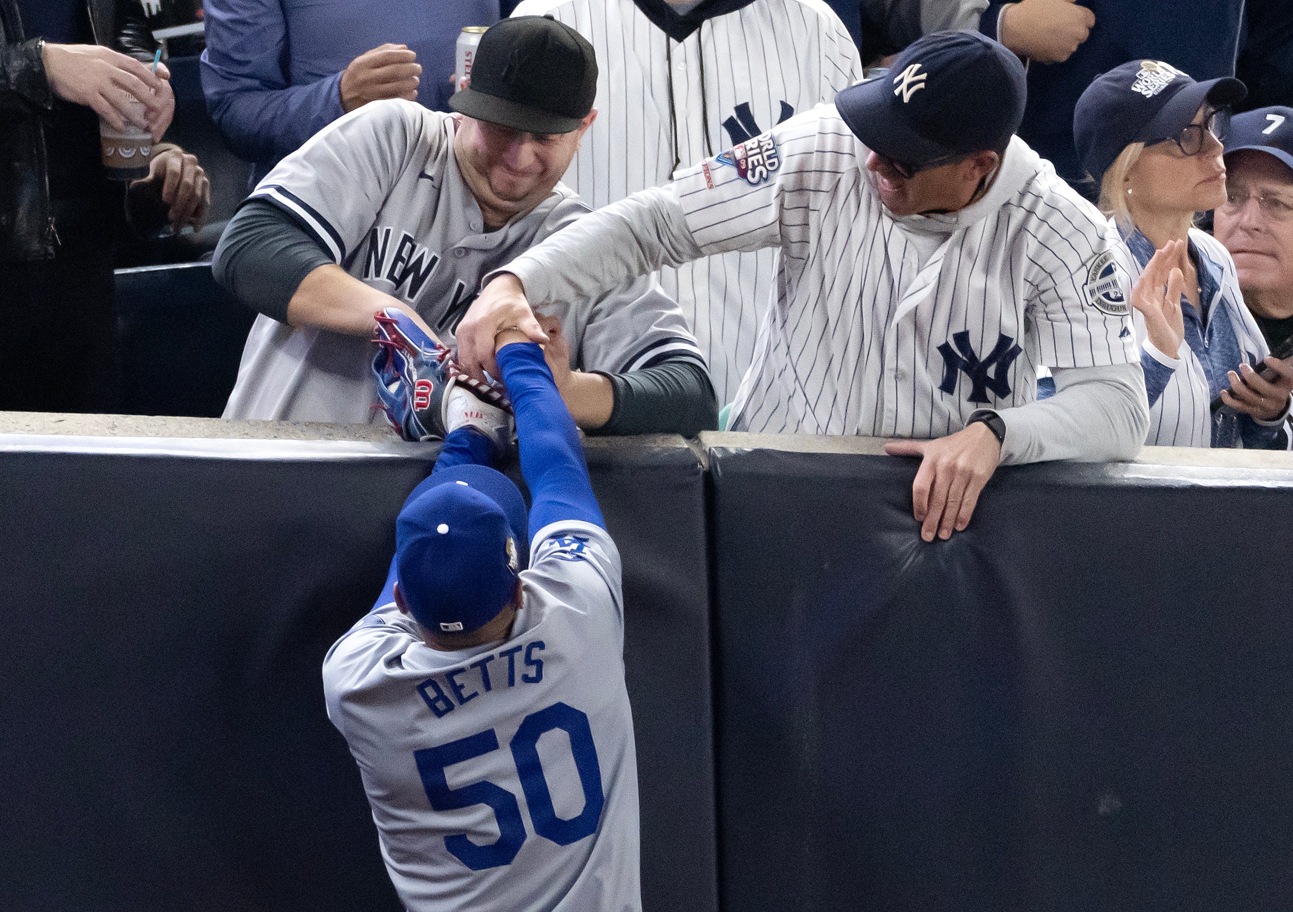 Yankees fans ejected from stadium during game four of World Series after interfering with Dodgers’ Mookie Betts