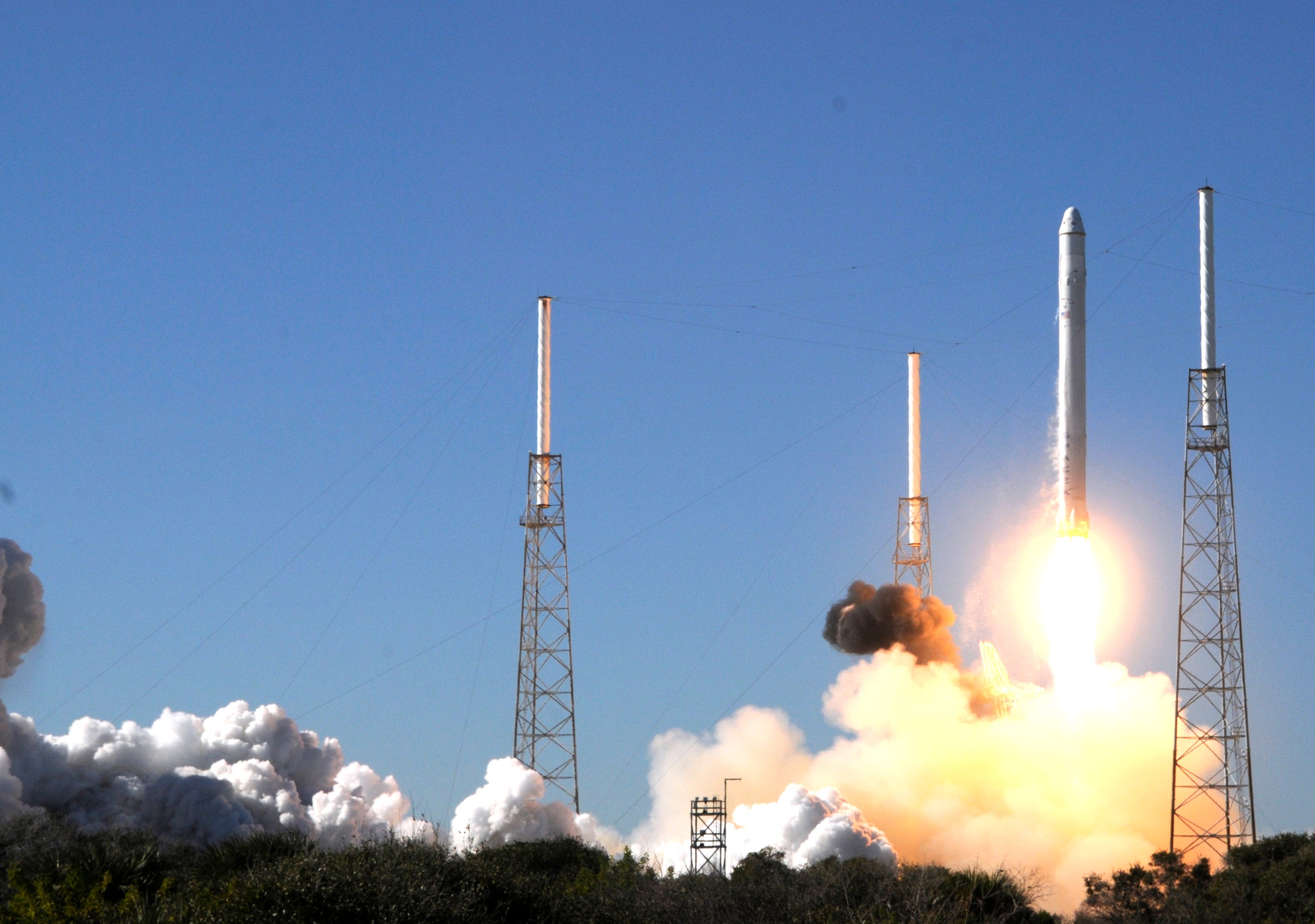 SpaceX's Falcon 9 rocket lifts for the first time off on December 8, 2010, in Cape Canaveral, Florida. The company later acknowledged there had been a rocket engine anomaly during its launch. Now, a new book describes what happened after the Dragon was retrieved