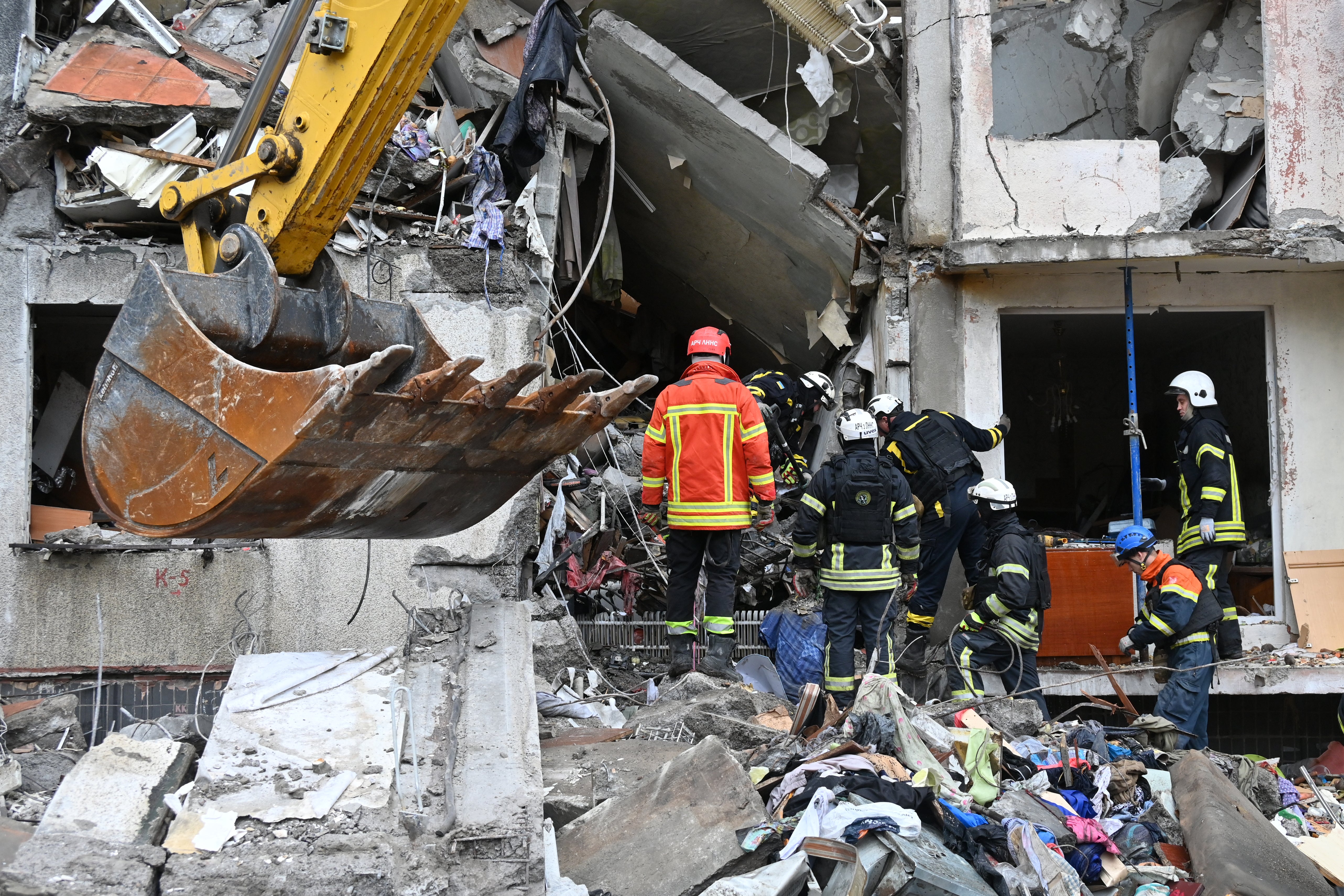 Ukrainian rescuers work at the site of a Russian missile attack in Kharkiv on 31 October 2024