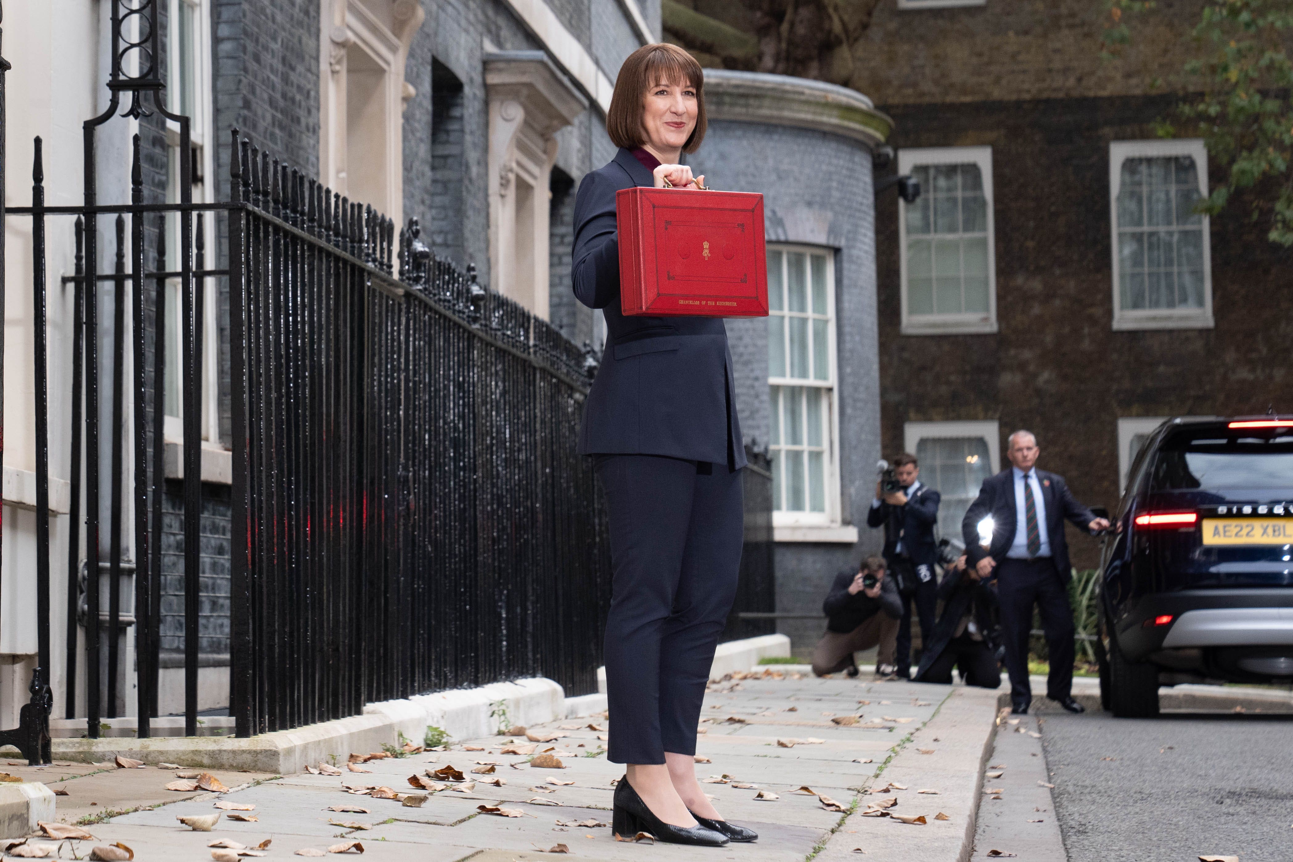 Chancellor Rachel Reeves holds up her ministerial red box (Stefan Rousseau/PA)