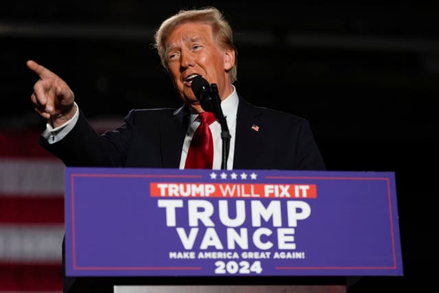 <p>Donald Trump speaks in Michigan on Friday. The former president has asked close allies why women don’t like him in the lead-up to Election Day, a new report reveals</p>