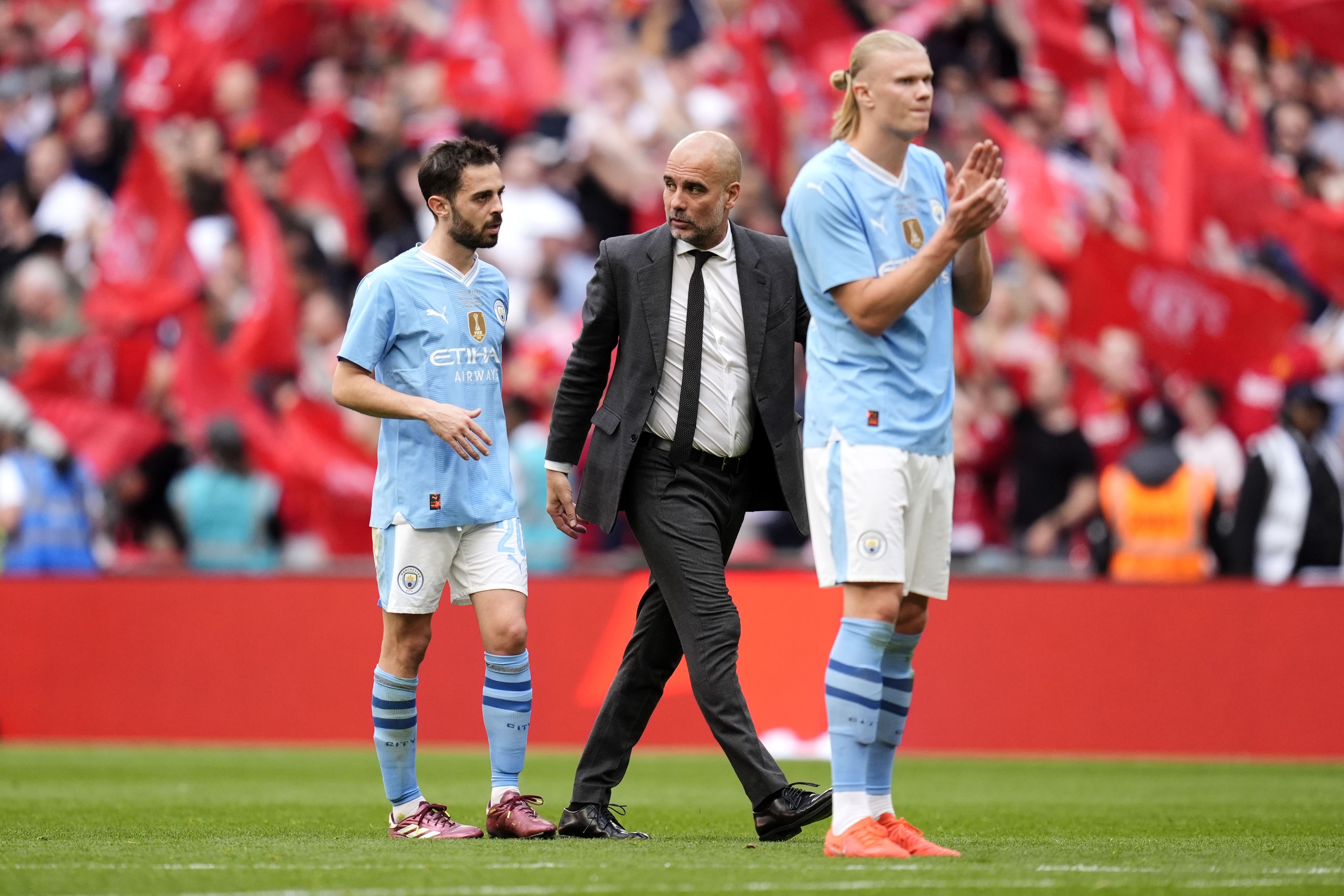 Pep Guardiola (centre) claims he was joking when he said his players were “hungover” at Wembley (Nick Potts/PA)