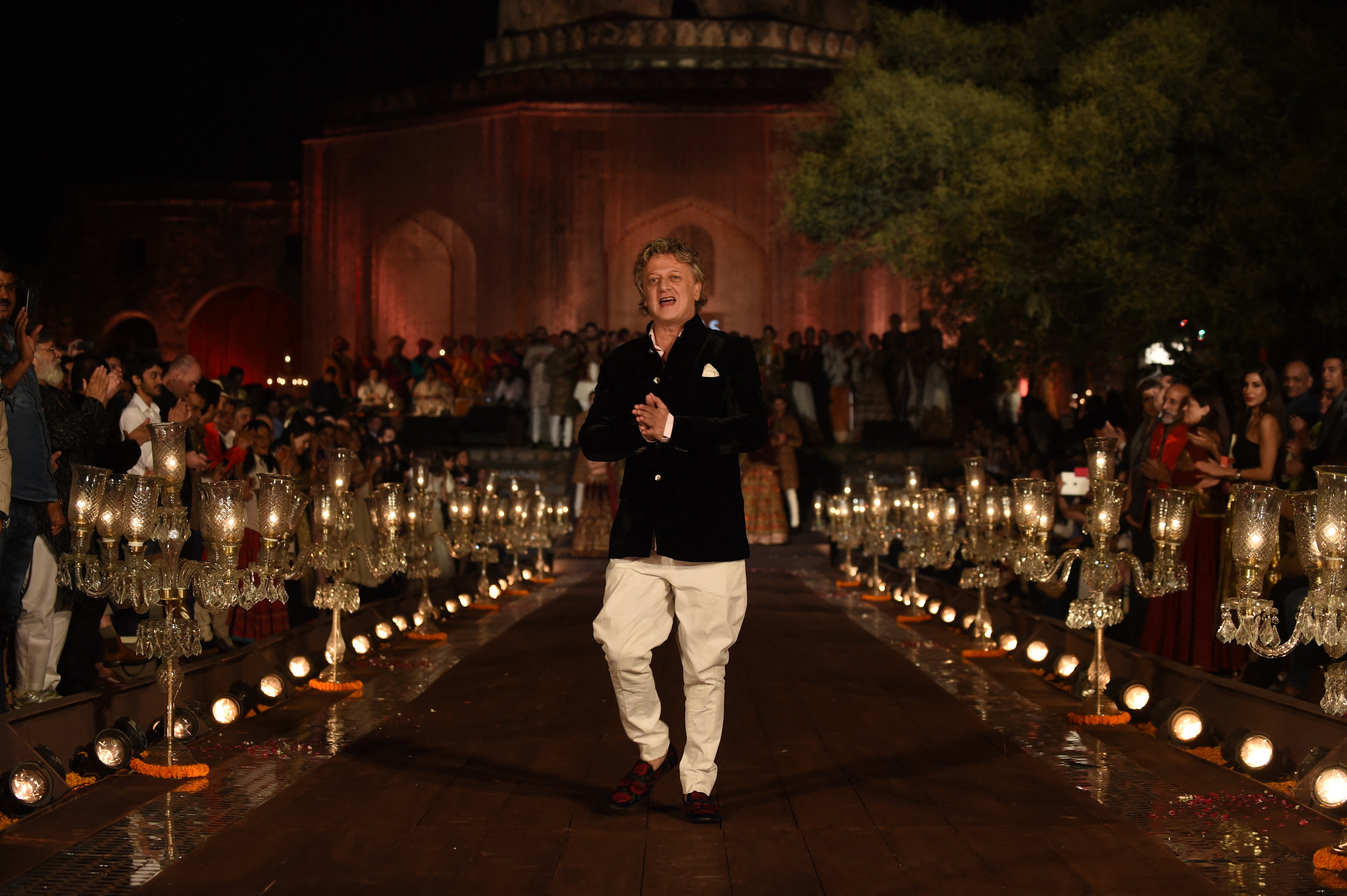 File Indian designer Rohit Bal walks on the catwalk during the Grand Finale of the Wills Lifestyle Indian Fashion Week Spring/Summer 2015 Collection